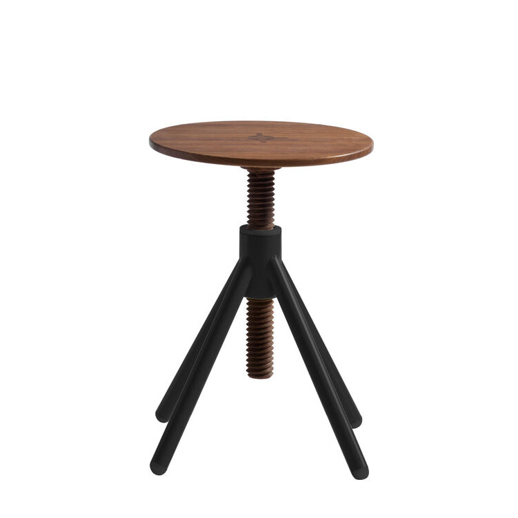 The Thread Family - Stool by Coordination Berlin is a modern wooden stool featuring a round walnut or oak seat, adjustable height via a threaded rod, and supported by three angled black metal legs for an industrial look.