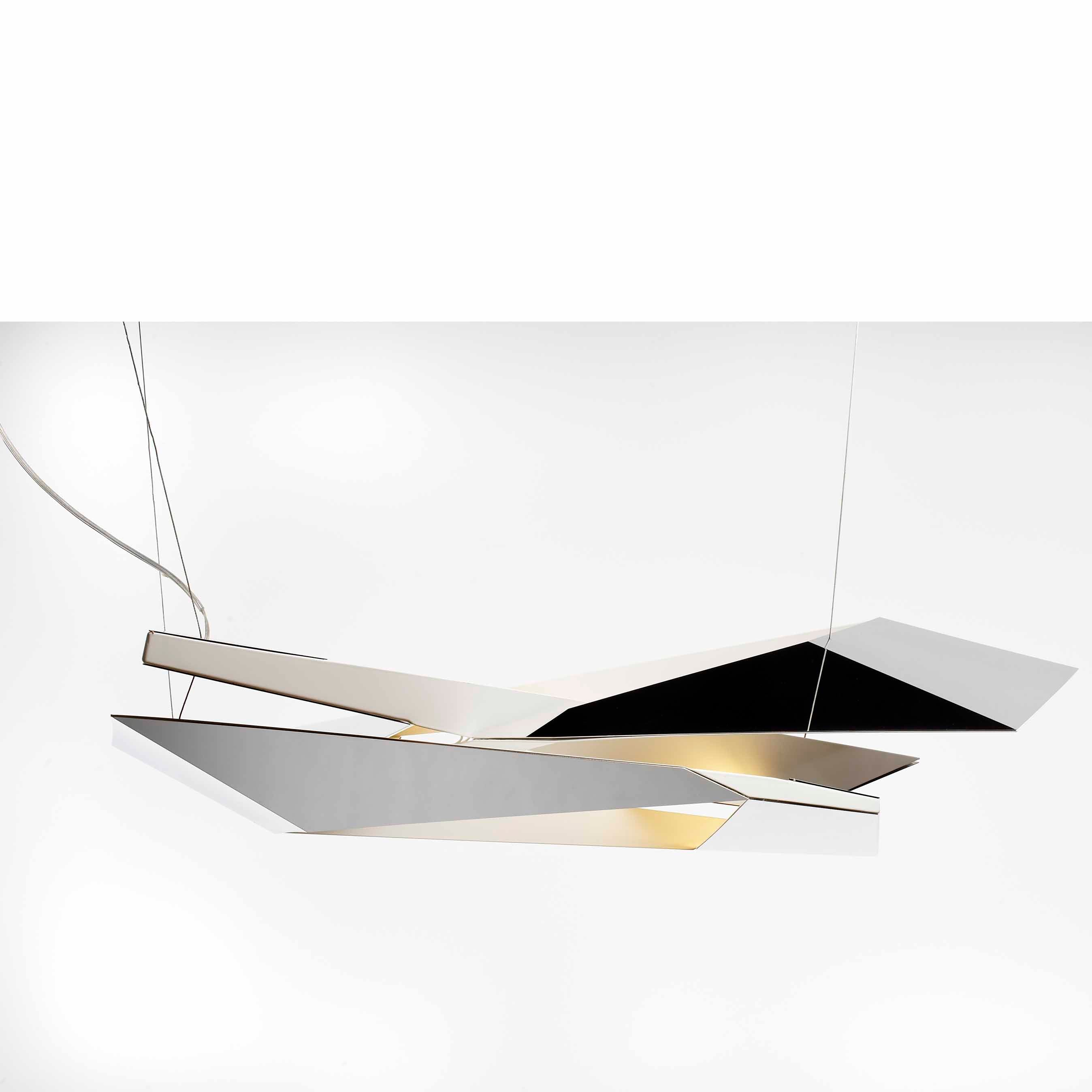 The Polygon Crash by Coordination Berlin is a handcrafted modern pendant light featuring angular geometric shapes in black and white, suspended by thin wires. It casts soft light against a plain white background, with polished stainless steel accents adding elegance to its minimalist design.