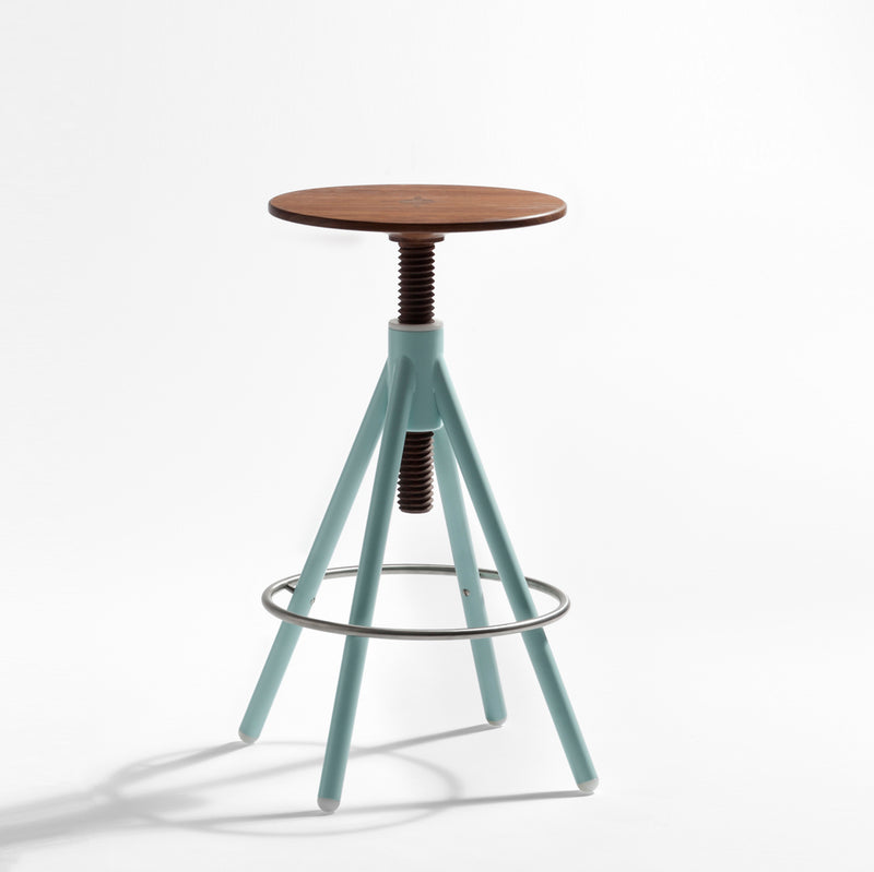 The Thread Family - High Stool by Coordination Berlin features a minimalist design with a walnut seat, light blue adjustable legs, and a metal ring footrest. Its modern look includes a screw-like mechanism for height adjustment, presented against a plain background.