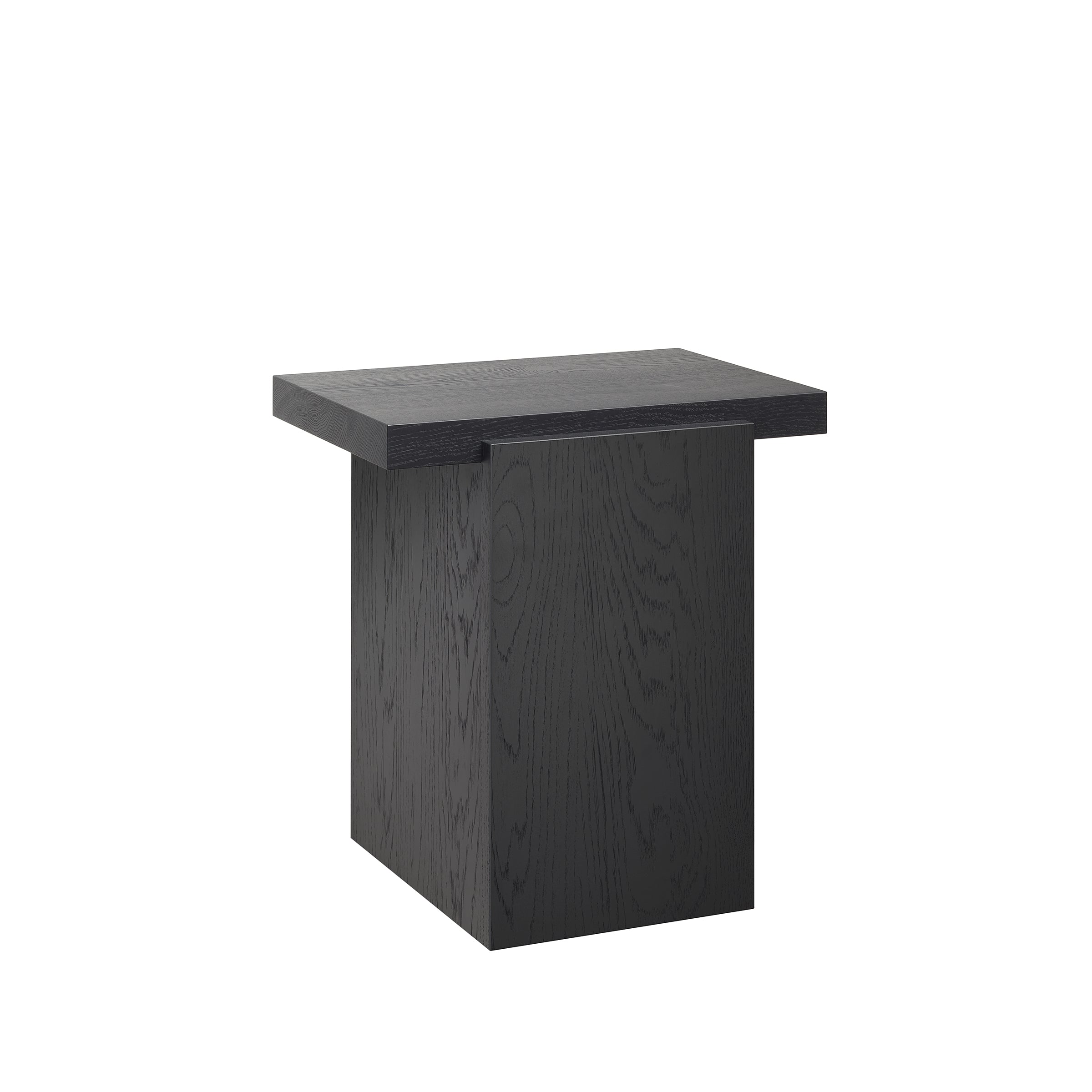 The DT02 TORE by E15 is a sculptural side table with a minimalist black wooden design, featuring a square top and solid rectangular base. Its clean lines and dark finish make it ideal for modern interiors.