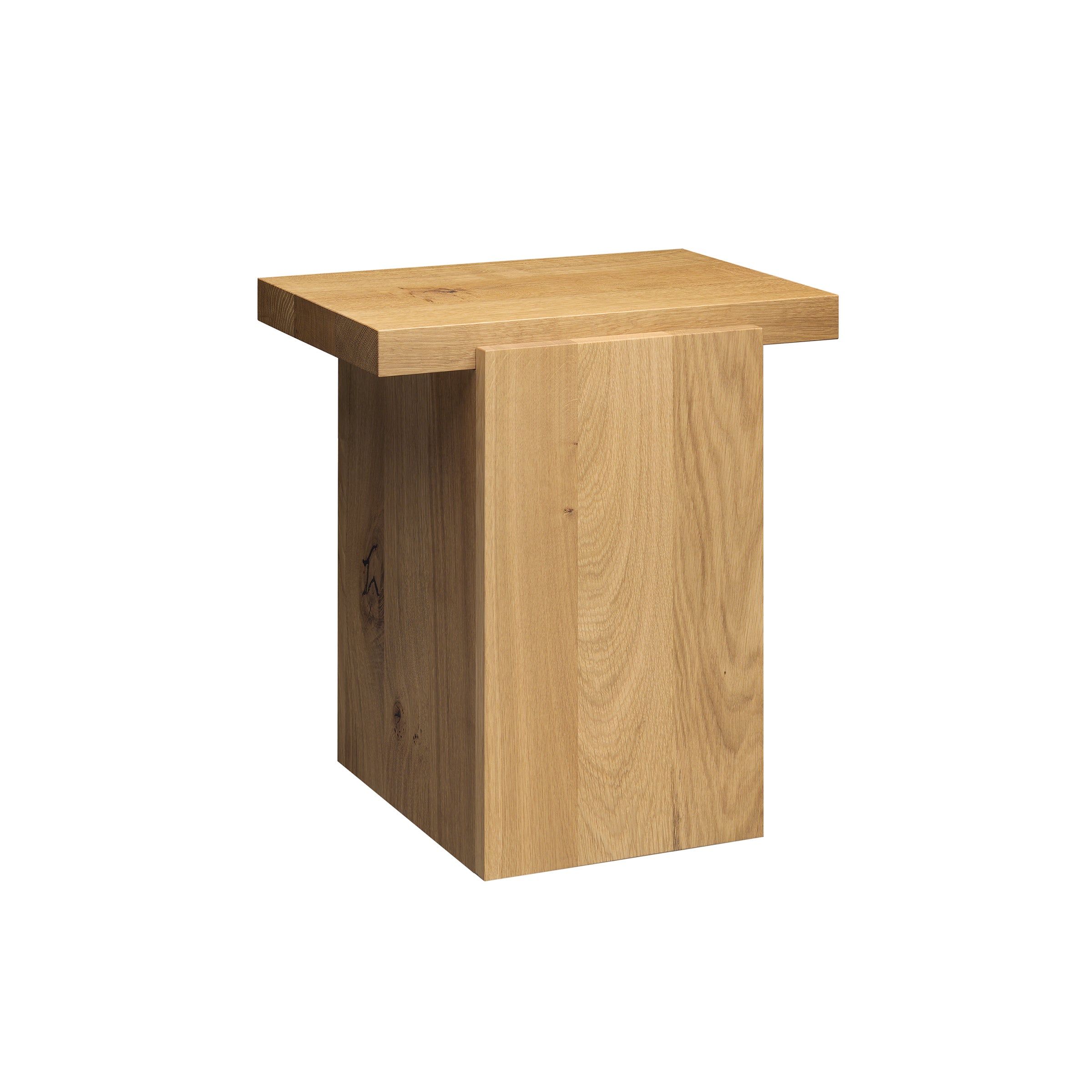 The DT02 TORE side table by E15 features a natural oak finish with a simple modern design, showcasing a square top and rectangular base. Its wood grain and knots add texture, merging art with practicality in this sculptural piece.