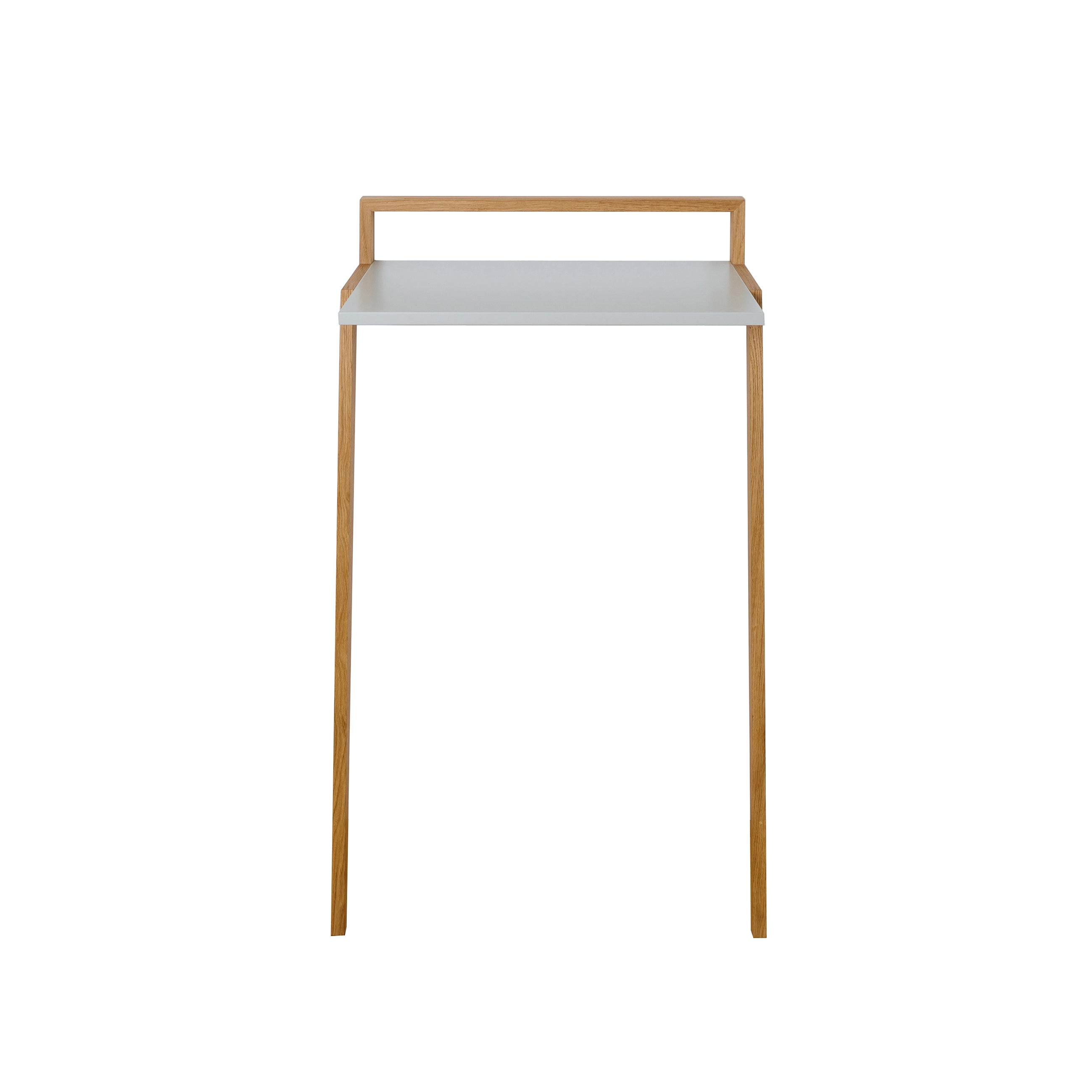The Buckowski by Das kleine b is a minimalist standing desk with a white tabletop and light wooden legs. It features a simple backboard, blending Scandinavian design into a sleek form. Its slim profile suits small spaces, ideal for crafting a modern mobile workplace.