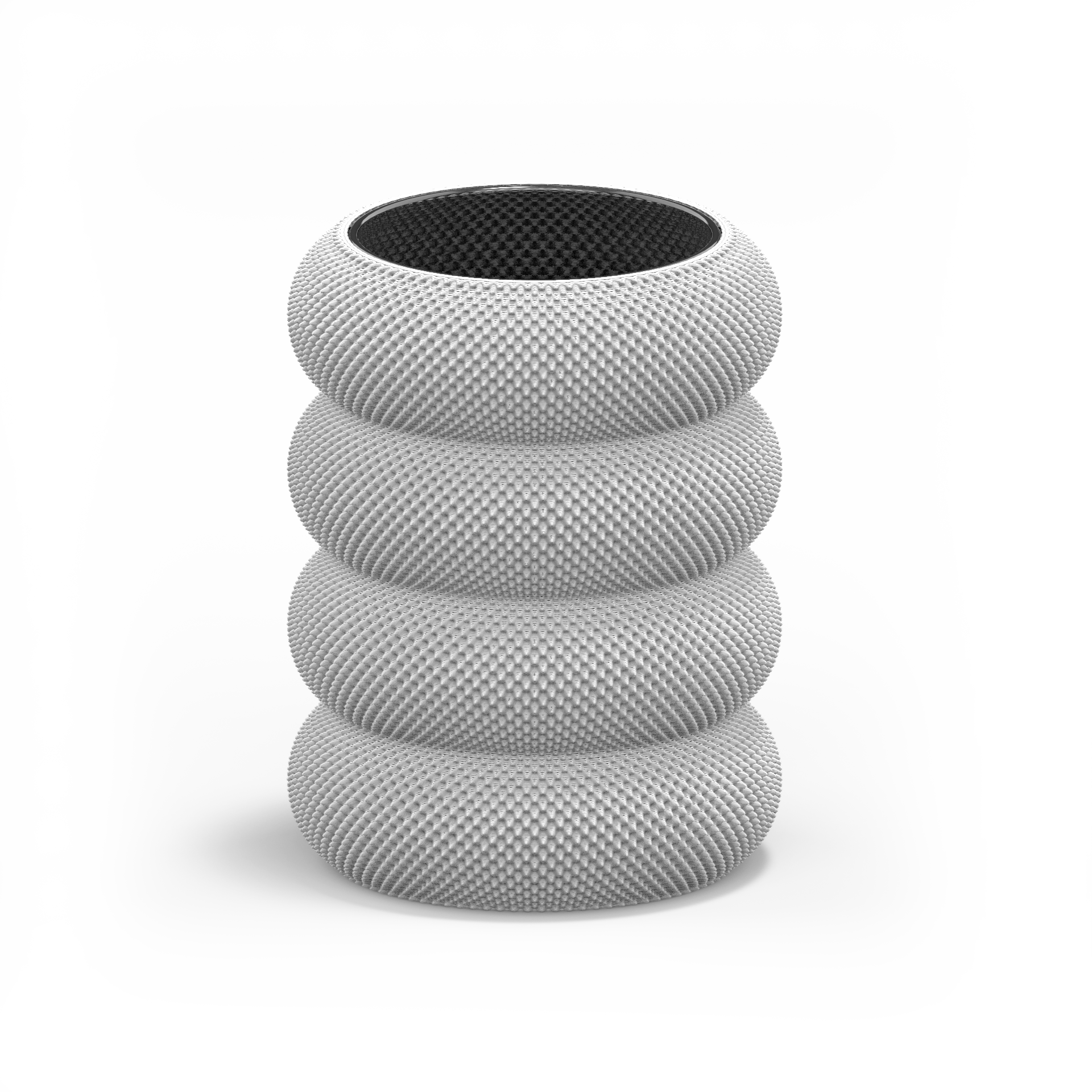 The Dorn 341g 1c Vase by Sheyn is a contemporary cylindrical piece with four stacked sections and a textured finish. Made using eco-friendly methods, its open top showcases a sleek black interior, merging innovation with sustainability against a plain white background.