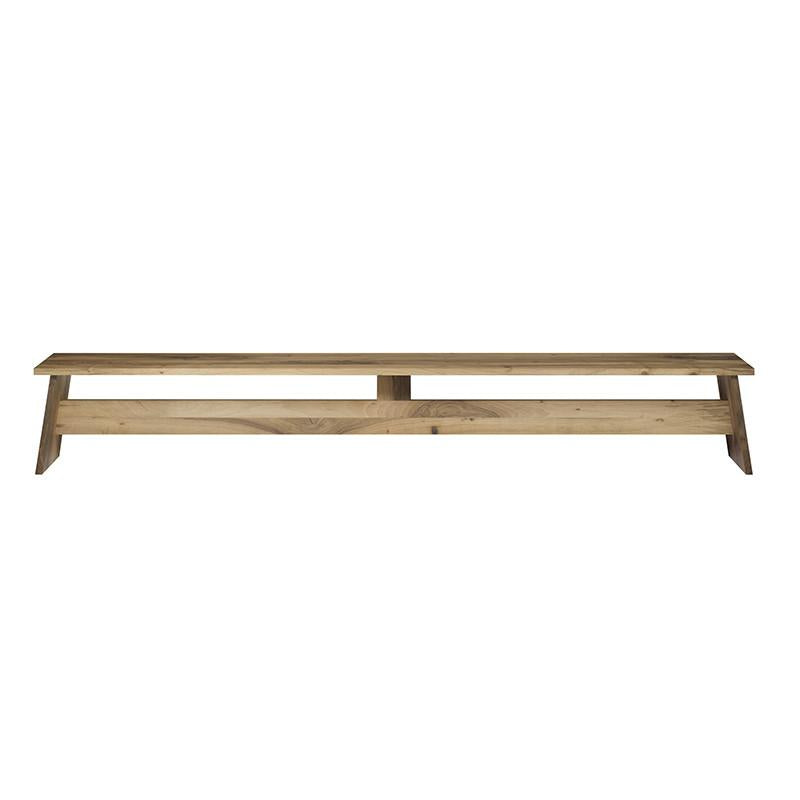 Introducing the DC02 FAWLEY by E15, a minimalist, solid wood bench designed by David Chipperfield. It features a natural finish with a flat top and A-frame legs, offering simple rustic elegance.