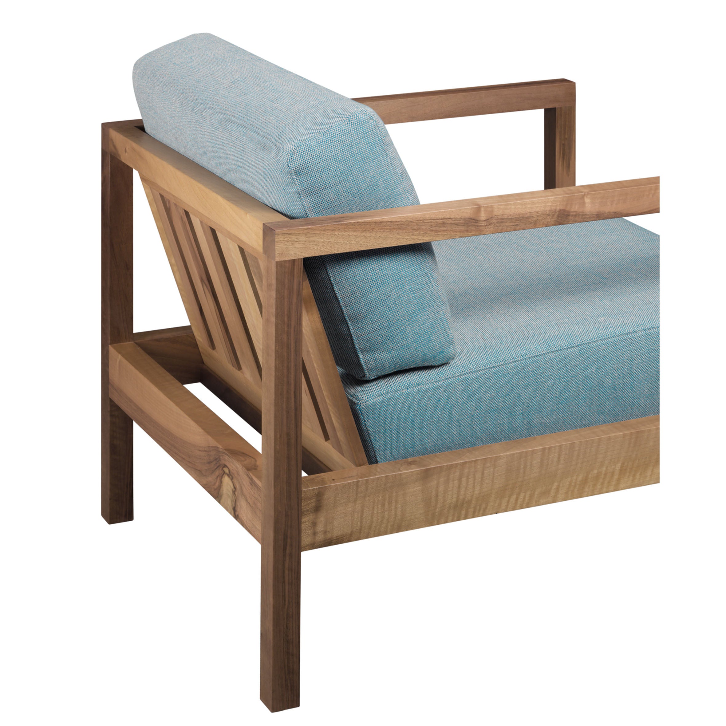 Side view of the EC01 BYRON armchair by E15, featuring a light wood frame and turquoise upholstery. This modern chair offers clean lines with a slatted backrest for a minimalist, contemporary look. Now on sale!.