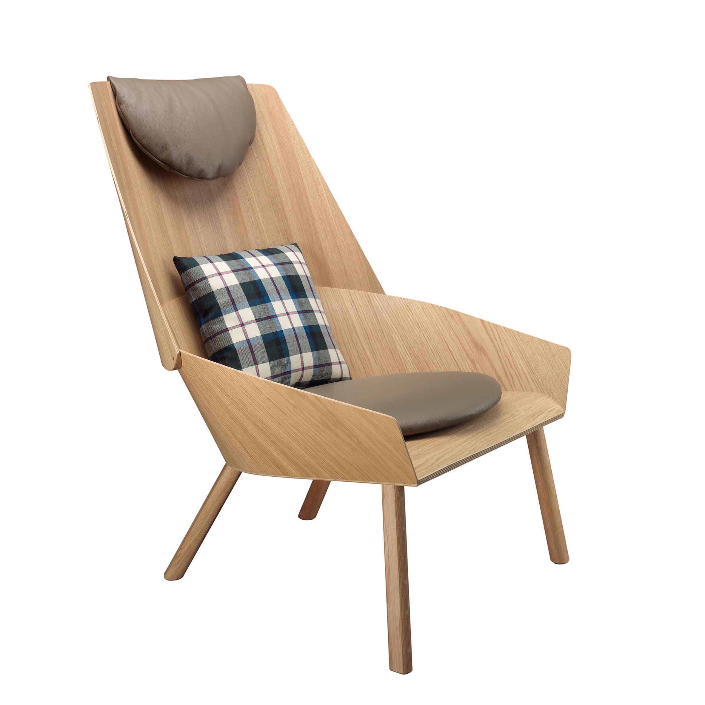 The EC03 EUGENE lounge chair by E15 is a modern wooden piece with an oak veneer finish, high backrest, and angled legs. It features a brown leather headrest and cushion complemented by a plaid pillow in green, navy, and white.