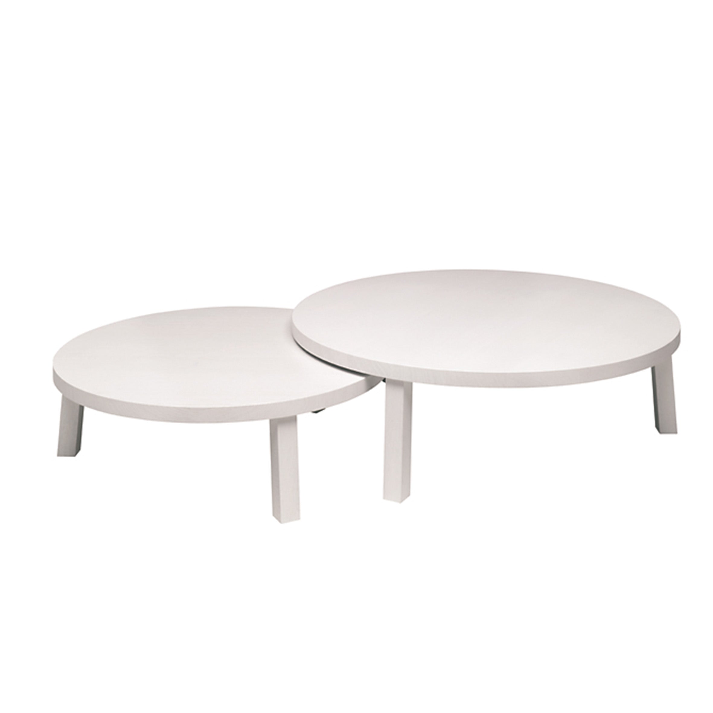 Two overlapping round white coffee tables of varying heights and sizes enhance your space. On the left, E15s lower PA05 LEILA table features a minimalist four-leg design with stylish solid European oak accents.