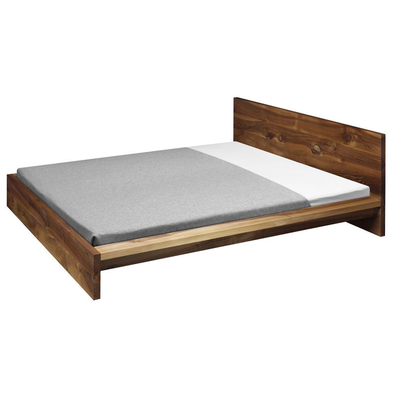 The E15 SL02 MO is a modern solid wood bed frame featuring a minimalist design and simple headboard, shown here with a gray mattress cover atop a white mattress in an empty room.