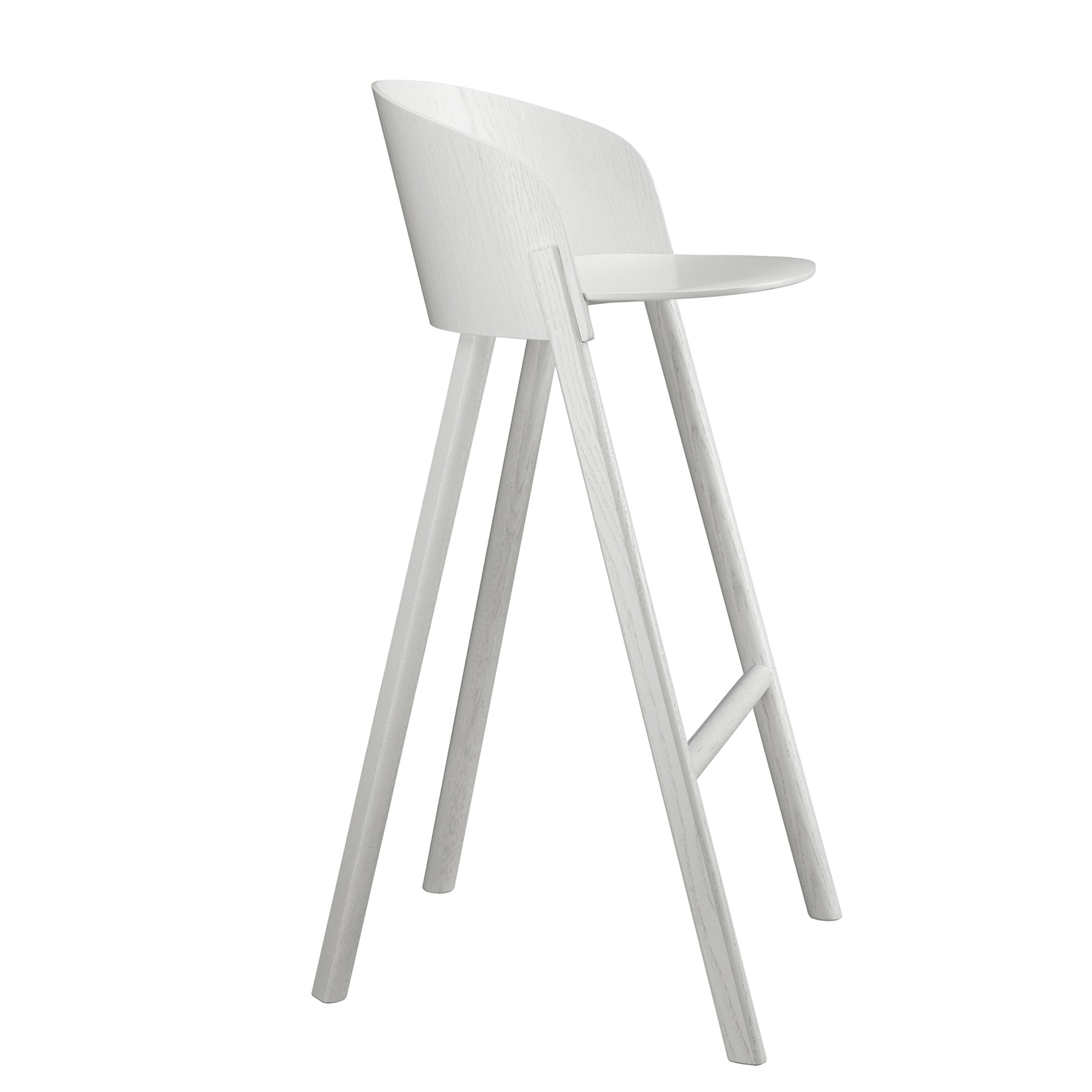 The ST12 OTHER by E15 is a modern, minimalist tall stool with a light gray finish. Part of a sleek series, it features a curved backrest and round seat for enhanced comfort, supported by four angled legs connected by a horizontal footrest.