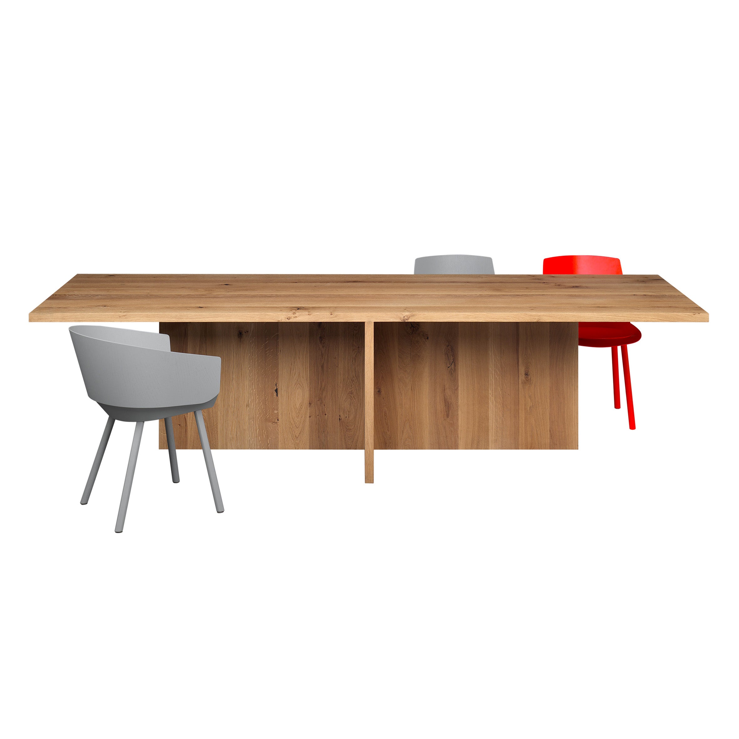 The TA18 ZEHN by E15 is a rectangular solid wood table made from European oak, with three chairs: a cushioned gray chair on the left, and on the right, a simple gray and a red chair. The plain white backdrop enhances its elegance.