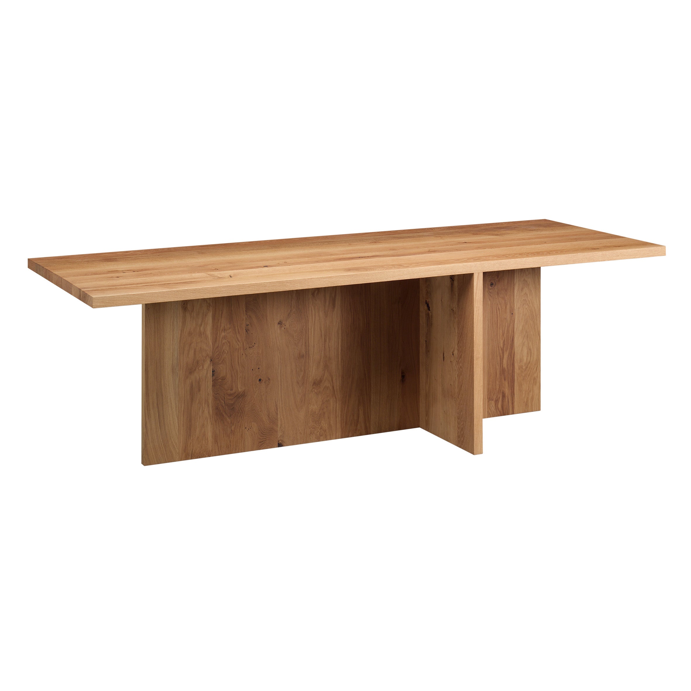 The E15 TA18 ZEHN table features a flat rectangular top and an abstract, solid base crafted from European oak. Its natural grain pattern offers a warm, earthy appearance with a minimalist and contemporary design.