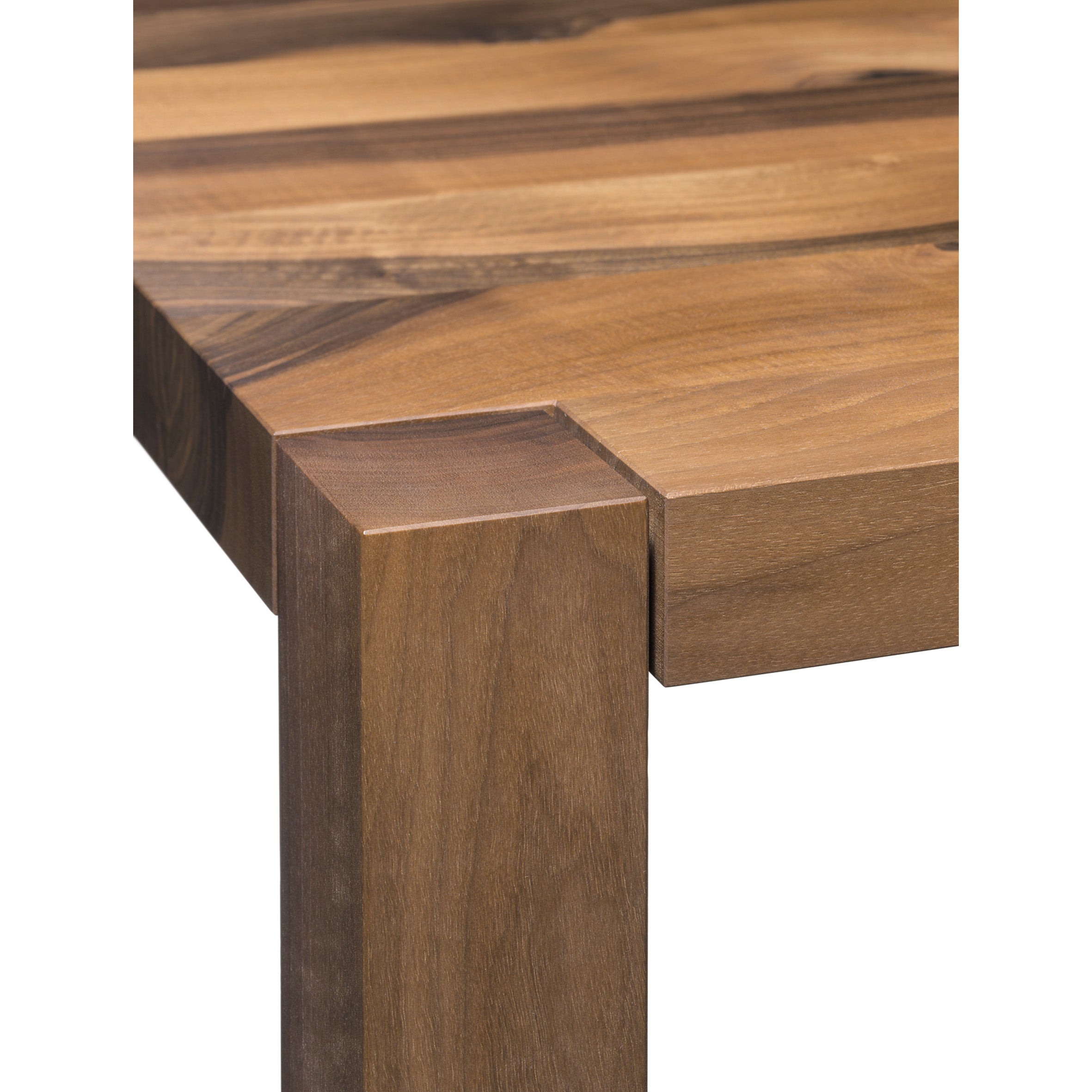 Close-up of the E15 TA19 SLOANE solid wood dining table corner, highlighting its smooth, polished surface with rich wood grain patterns and natural tones—an embodiment of elegant design.