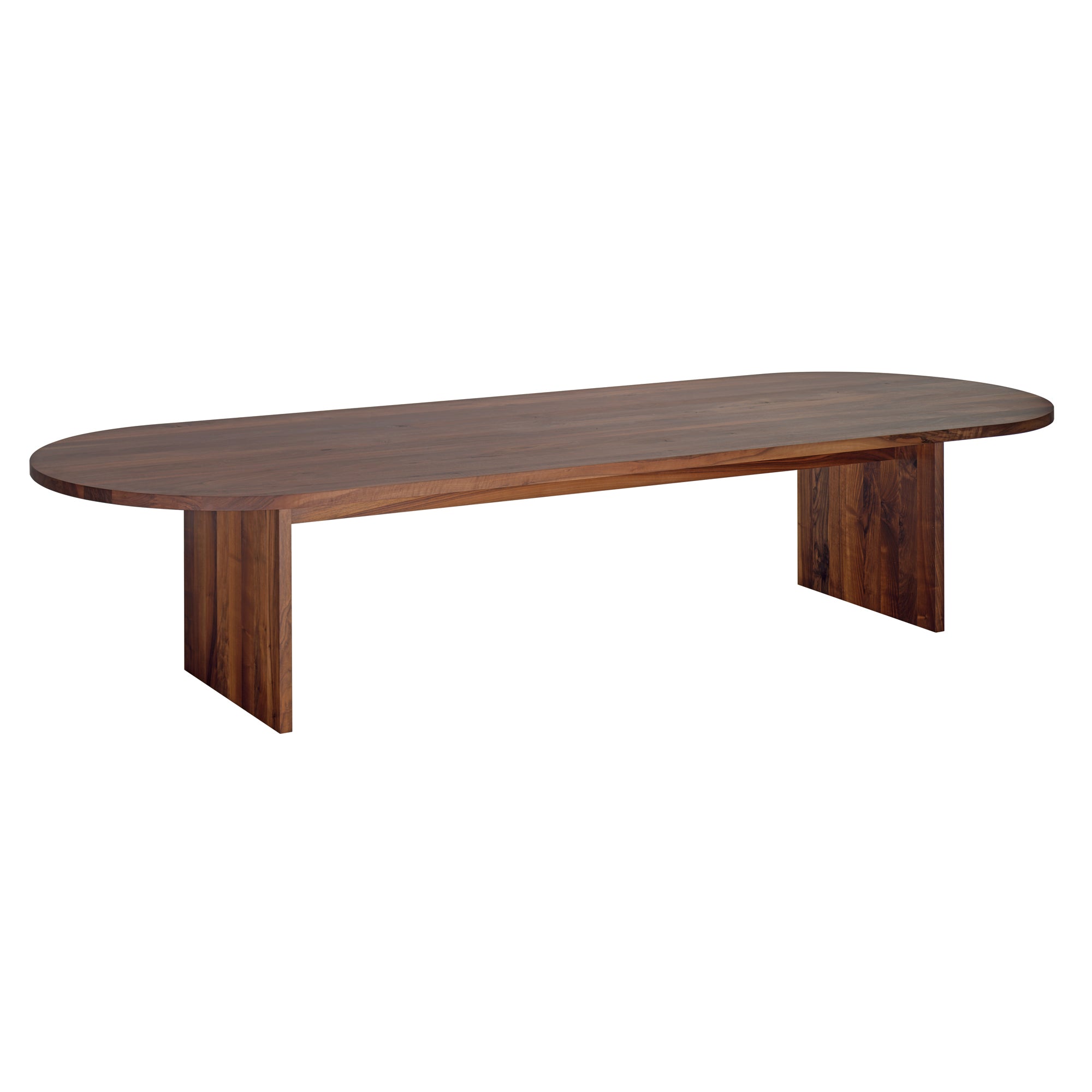 The E15 TA24 ASHIDA Oval is a long wooden table with a sleek design, featuring two wide legs and a polished surface. Crafted from rich European walnut, it showcases a dark brown hue and visible grain patterns that reflect ASHIDAs exquisite craftsmanship.