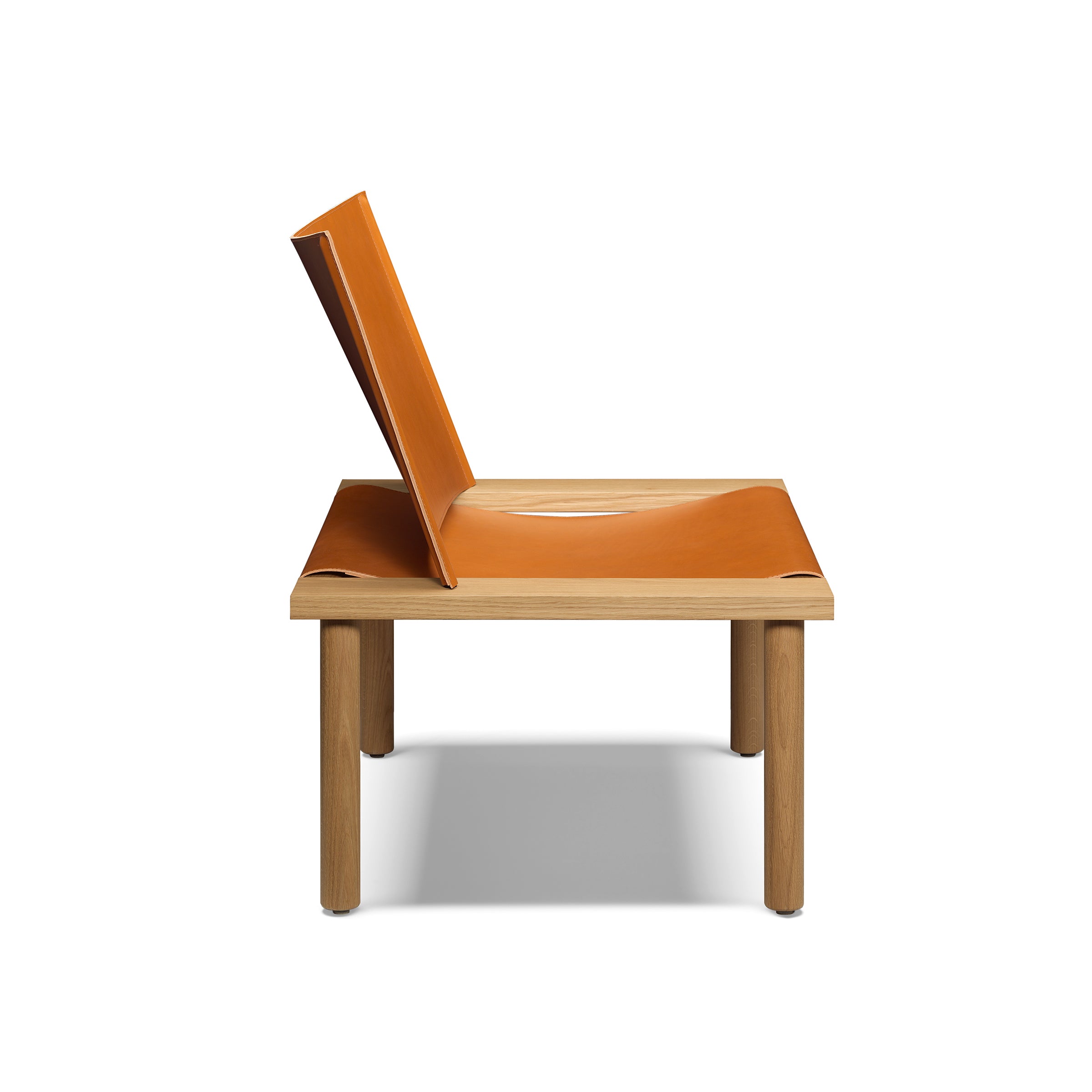 The EC06 ILMA Lounge Chair by E15 features a sleek, minimalist design with a solid wood frame and four legs. It has a slightly reclined, integrated orange seat and backrest made from natural materials, offering a smooth, continuous surface.