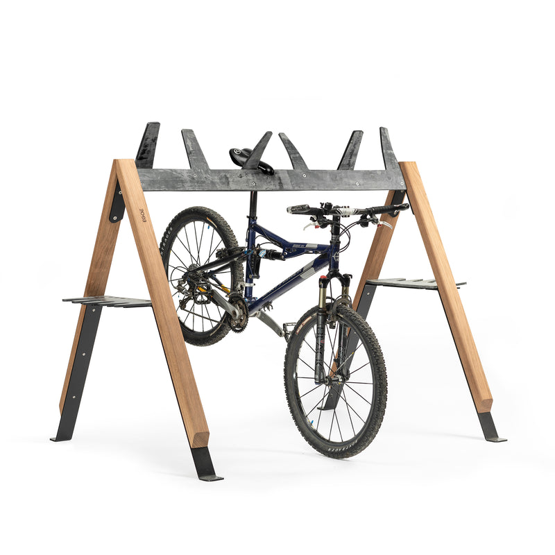 The Cabra Ski and Bike Rack by Egoe is a sleek A-frame crafted from modern wood and metal, securely suspending your mountain bike while showcasing its wheels and gears. It also serves as an equipment protector for various sporting gear.