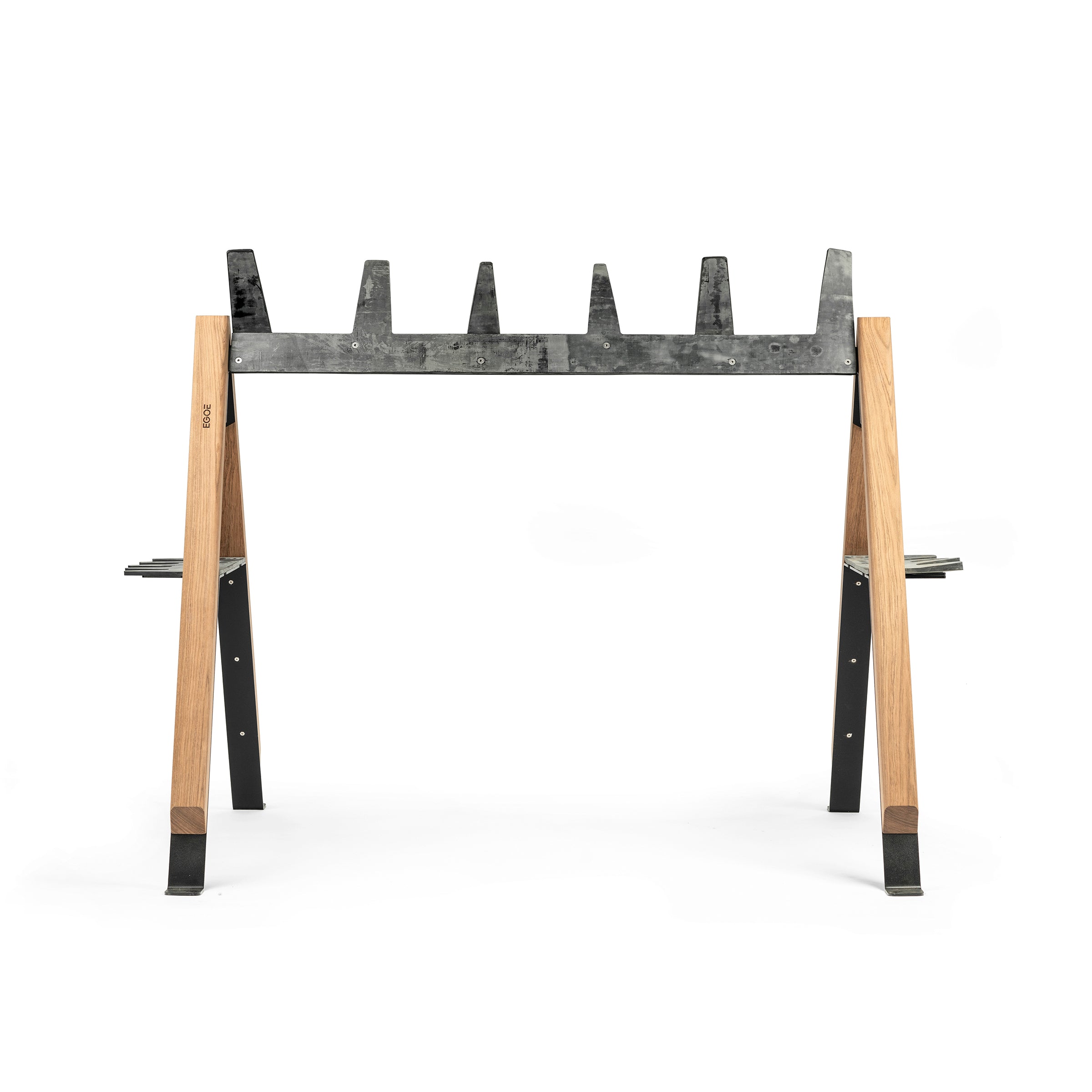 The Cabra Ski and Bike Rack by Egoe is a multifunctional outdoor rack featuring wooden legs and five upward-facing metal supports with v-shaped notches, perfect for securely holding logs or similar materials, set against a white background.