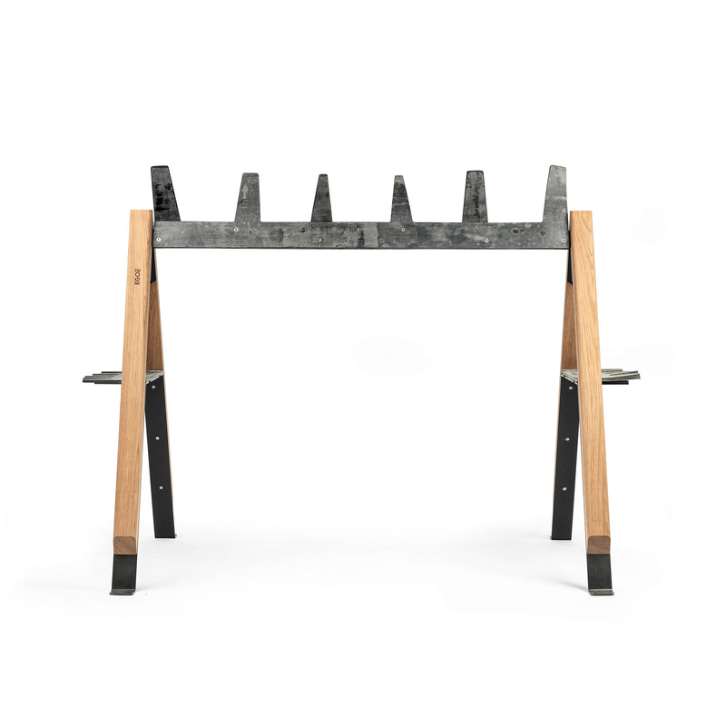 The Cabra Ski and Bike Rack by Egoe is a multifunctional outdoor rack featuring wooden legs and five upward-facing metal supports with v-shaped notches, perfect for securely holding logs or similar materials, set against a white background.
