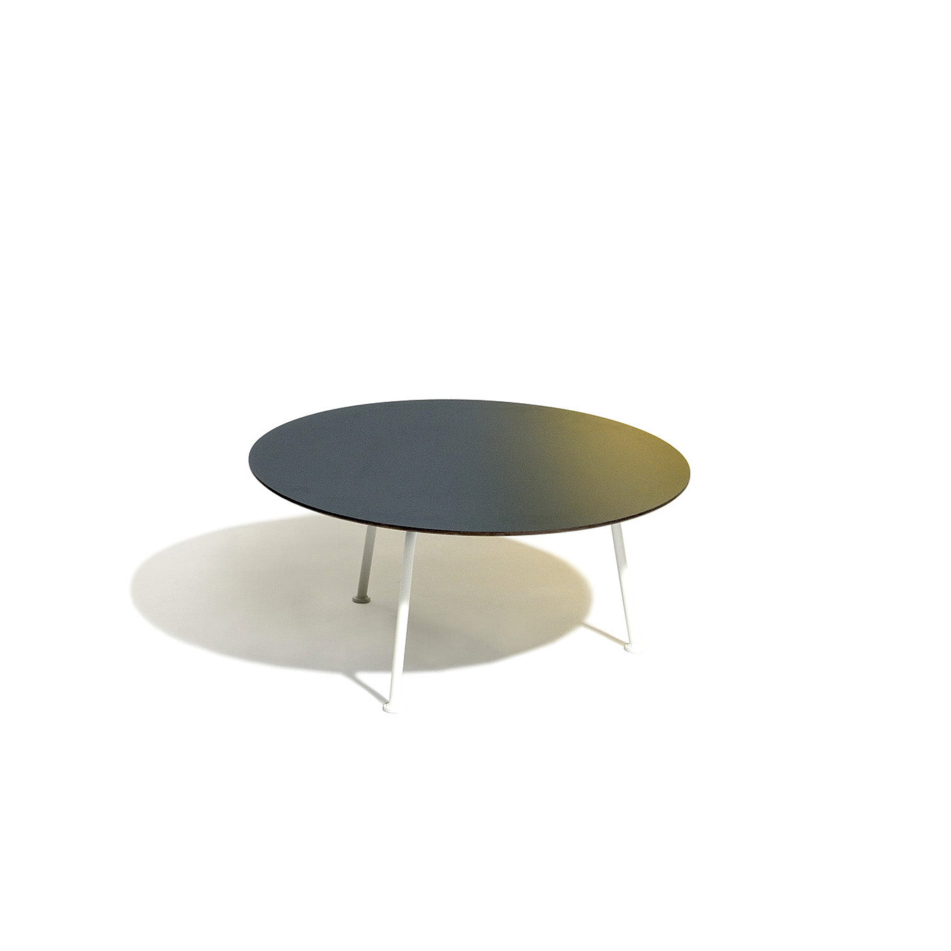 The Maj Lounge Table by Egoe is a minimalist design with a round black high-pressure laminate top and four slender powder-coated steel legs in white. Suitable for indoor and outdoor use, its elegantly set against a plain white background.