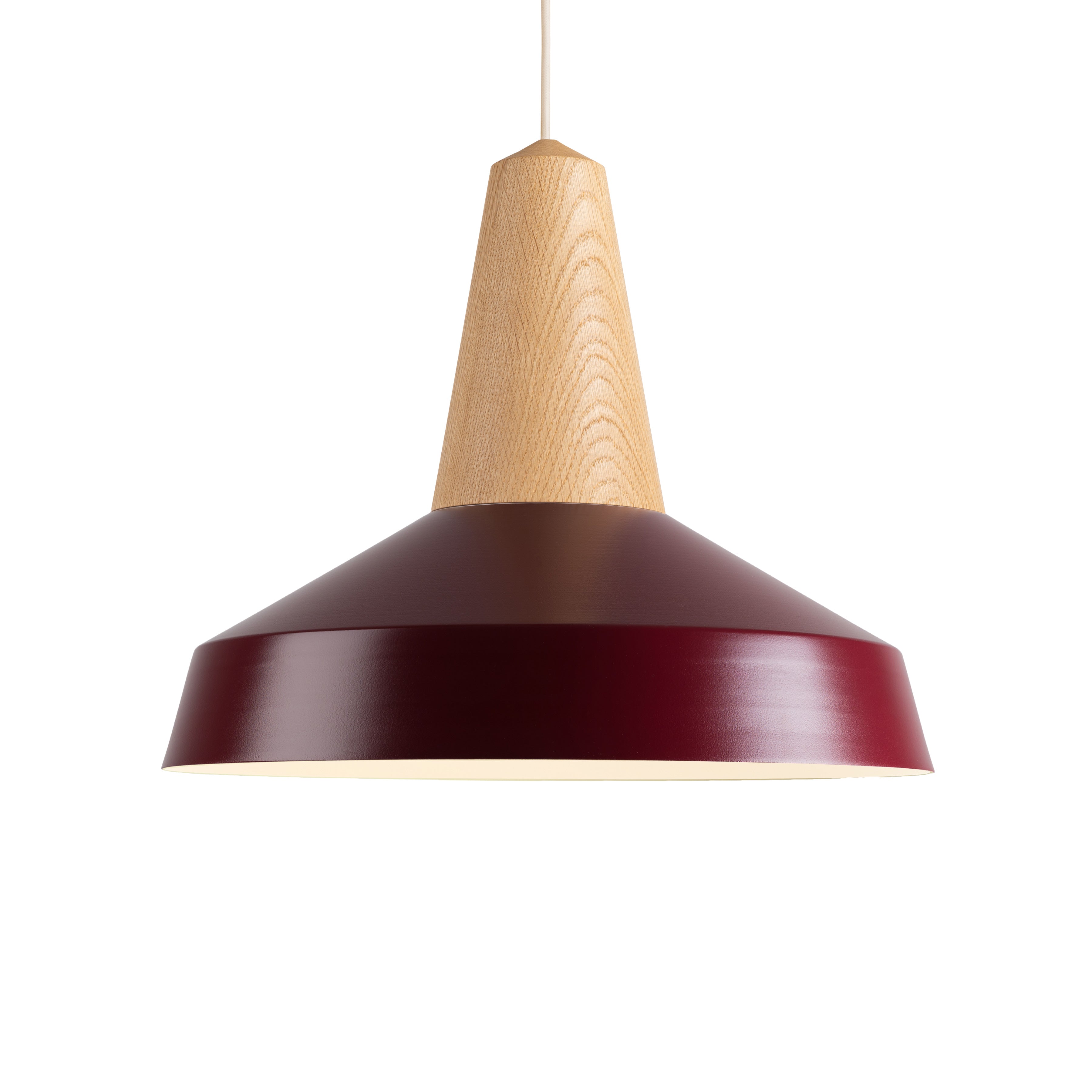 The Eikon Circus Burgundy by Schneid is a contemporary pendant light with a wide, deep red metal shade and wooden top, suspended from a thin cord. Its industrial design seamlessly combines elegance and functionality.
