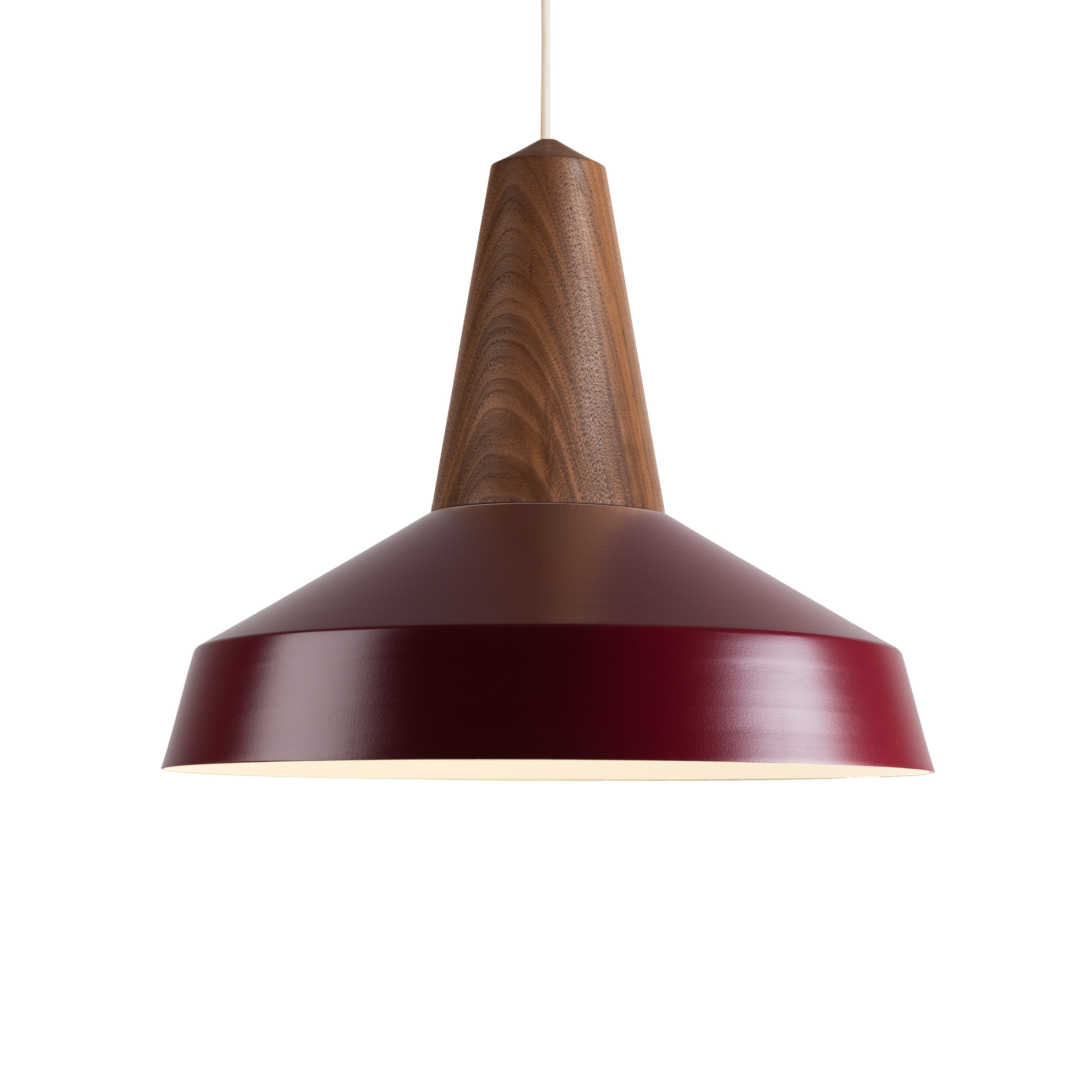 The Schneid Eikon Circus Burgundy pendant light features a wooden fixture with a maroon metal shade, suspended from a cord. This industrial design blends natural wood textures with a sleek, glossy finish for contemporary elegance in any space.