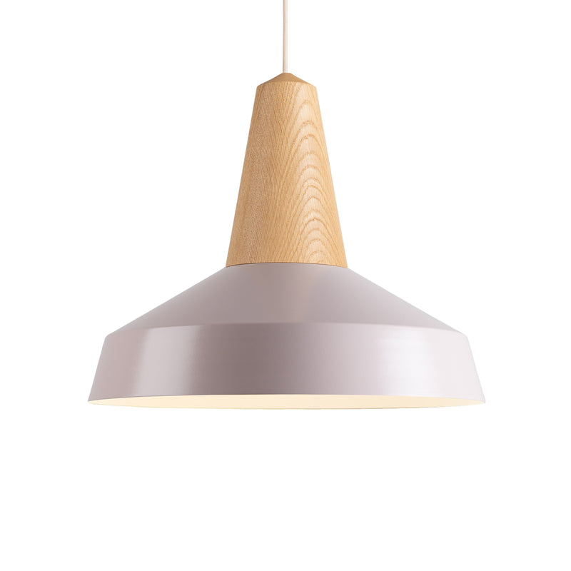 The Eikon Circus Pale Rose - Sale by Schneid is a modern pendant light featuring a sleek, conical pale rose shade. Its top part, crafted from light wood, brings a natural touch. Hanging from a thin cord, it complements minimalist or contemporary interiors and offers a fresh expression.
