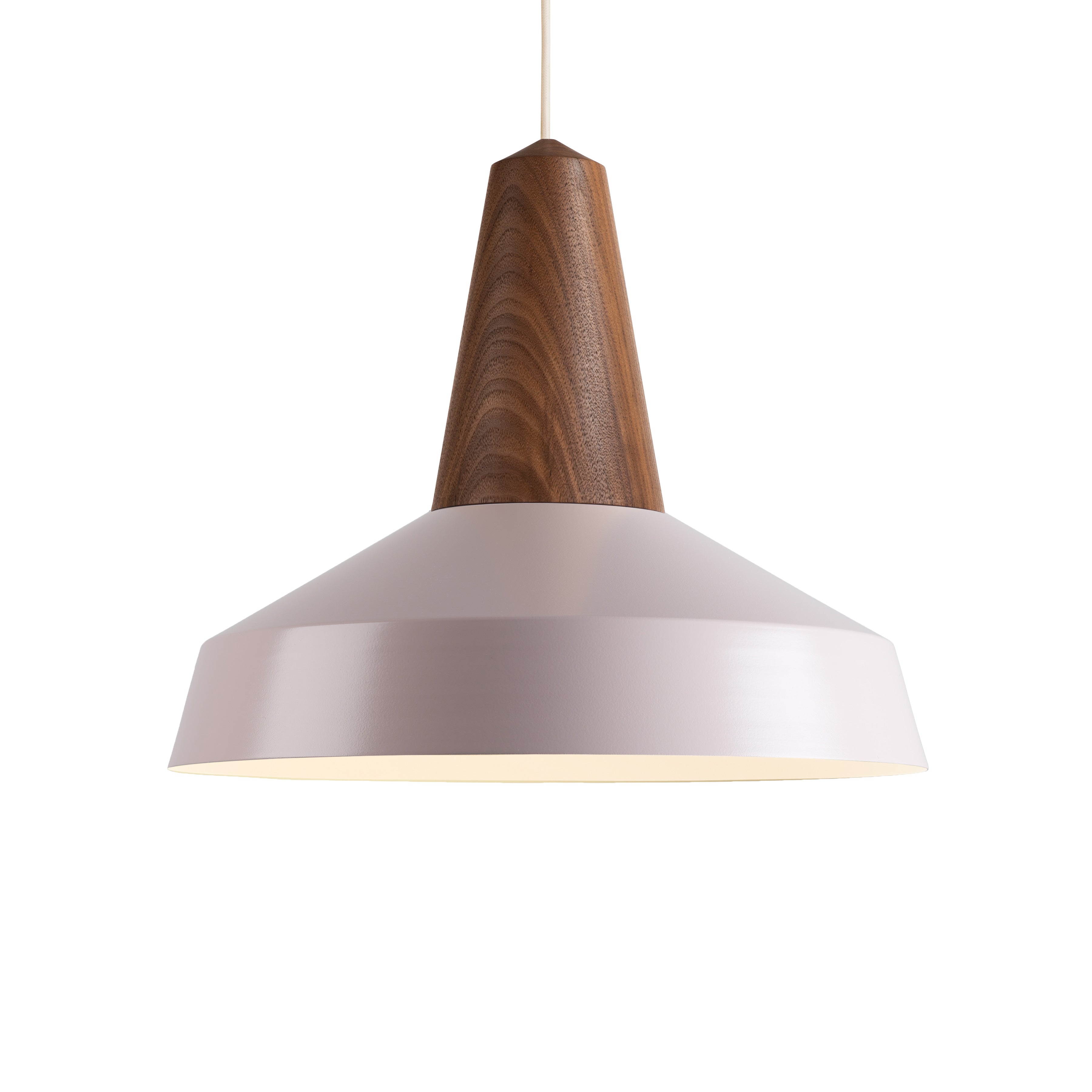The Eikon Circus Pale Rose by Schneid is a modern pendant light featuring a conical design with a pale rose metal shade and wooden top. Suspended by a thin cord, its sleek, minimalist style embodies contemporary expression, making it perfect for any industrial space.