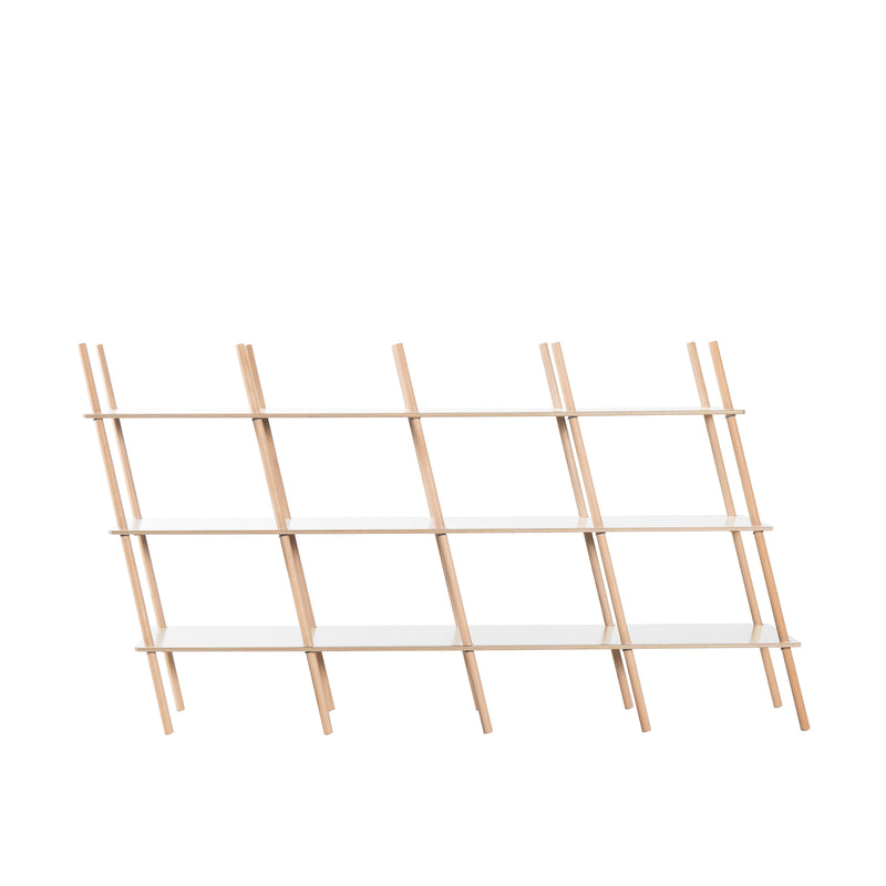 The Moormann Es Sideboard is a modern piece made from birch plywood, featuring three white shelf boards. Its angled vertical supports give it a distinct diagonal look, embodying minimalist and contemporary elegance with precise craftsmanship.