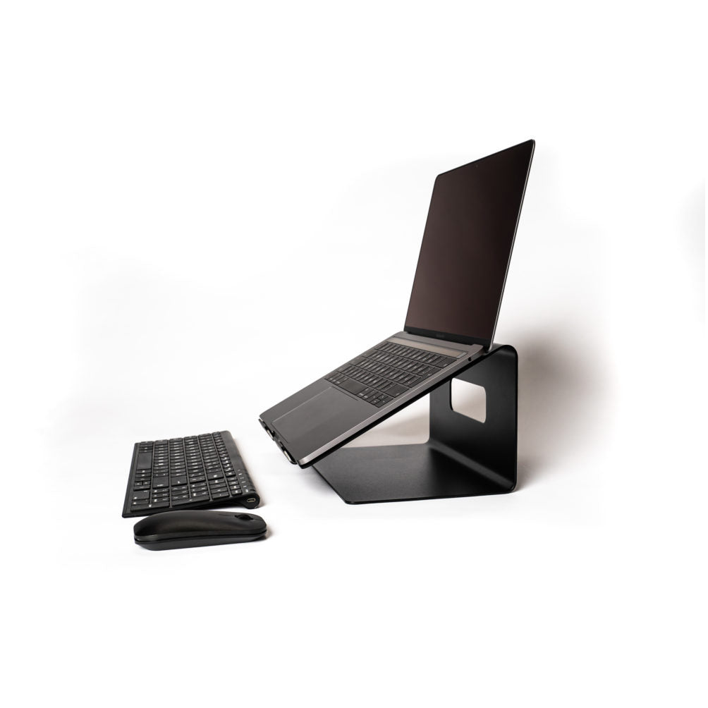 An Echtstahl Laptop Stand in sleek black steel elegantly holds a laptop next to a wireless keyboard and mouse, all set against a white background for a minimalist, modern look that ensures an ergonomic viewing experience.
