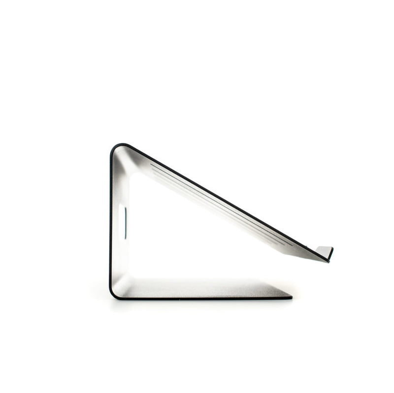 Echtstahls Laptop Stand is a minimalist, high-quality steel stand for tablets or phones with a sleek angular design on a white background. Its simple geometry and metallic finish offer a modern look, perfect for ergonomic viewing.