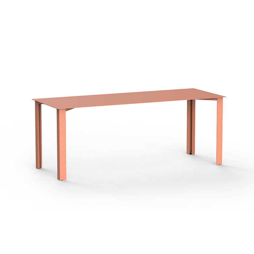The PILON Table by Echtstahl is a minimalist rectangular dining table with a light brown surface and four straight legs, featuring height-adjustable feet. Its simple and modern, set against a plain white background.