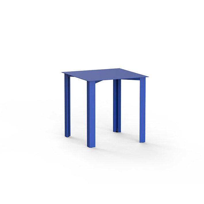 The PILON Table by Echtstahl is a minimalist blue dining table featuring a square top, four legs, and height-adjustable feet, set against a plain white background.