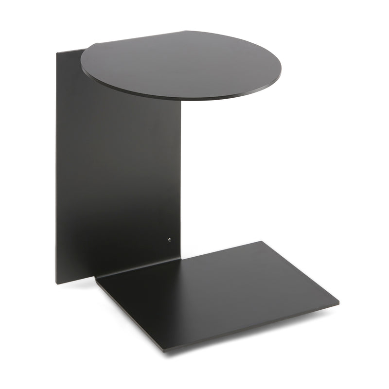 Introducing the Plateau side table by Echtstahl, a minimalist black metal piece made from powder-coated steel. Its round top and rectangular base are joined by a vertical panel, delivering a sleek design that complements contemporary interiors with versatile elegance.
