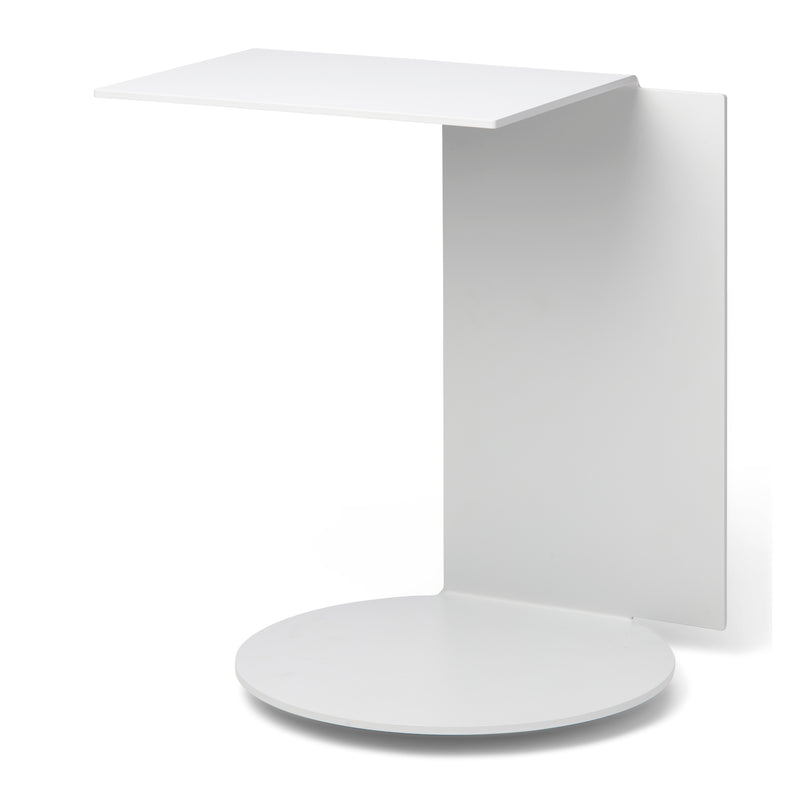 The Echtstahl Plateau side table boasts a minimalist design with a rectangular top and vertical support in powder-coated steel. Its versatile, sleek modern look is enhanced by an L-shaped overhang on the circular base for added functionality.