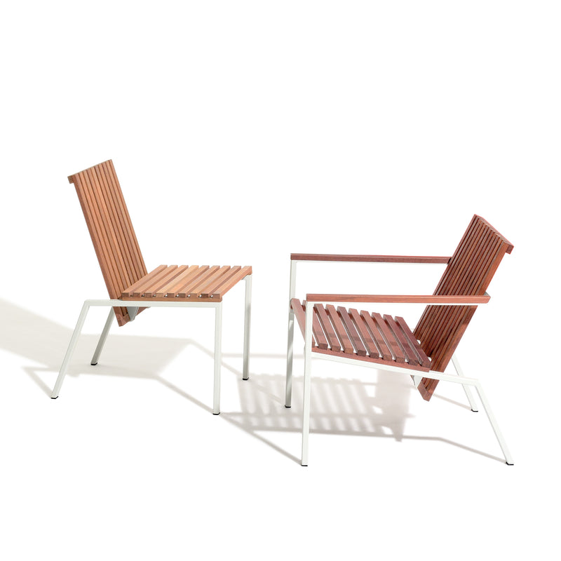 The Axis Chair by Egoe features two modern outdoor chairs with wooden slats and elegant white metal frames, made from durable zinc-plated steel. One chair is angled left, the other right, both set against a pristine white backdrop.