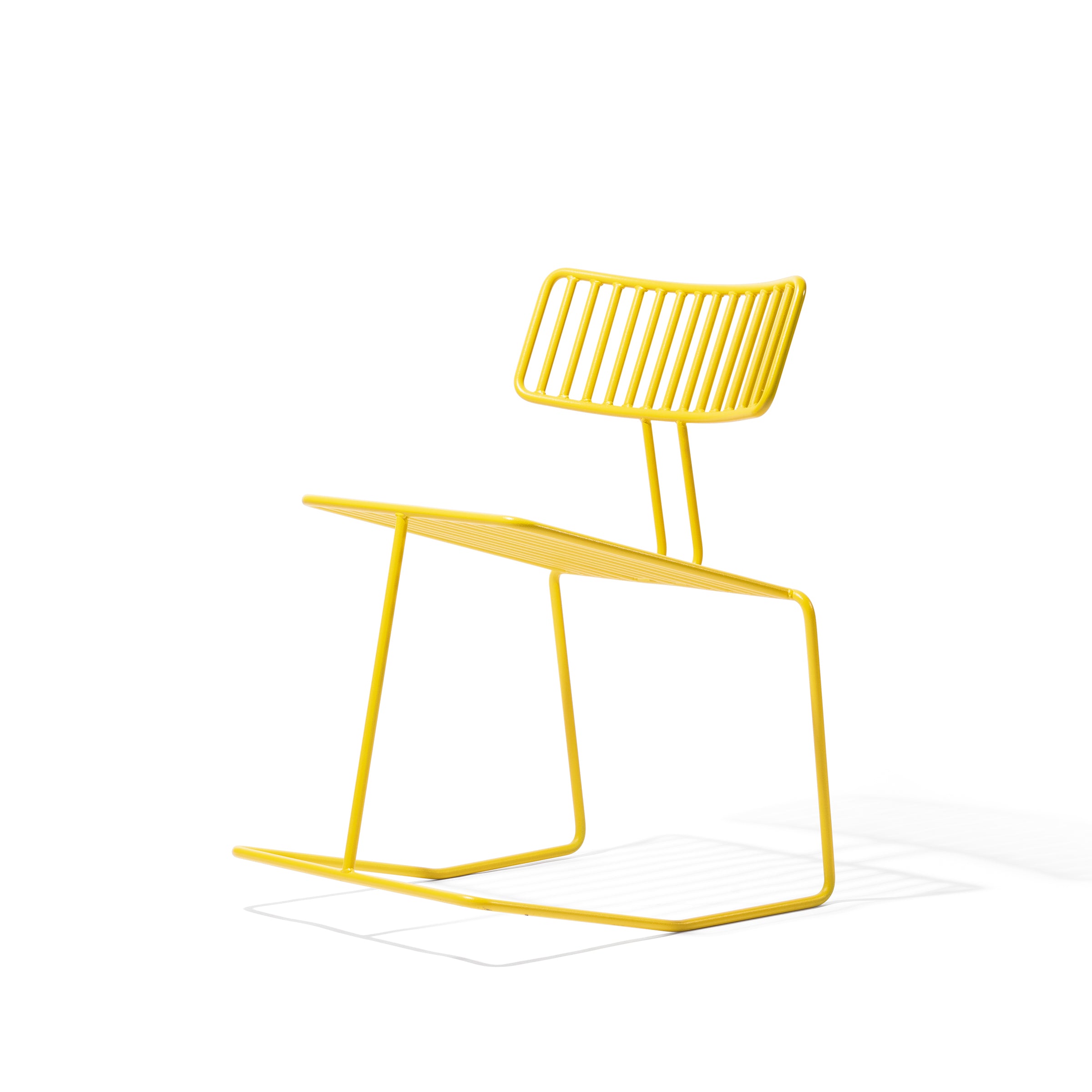 The Hope Chair by Egoe is a minimalist yellow wireframe chair featuring an elegant slatted backrest and seat, showcasing modern charm against a white background.