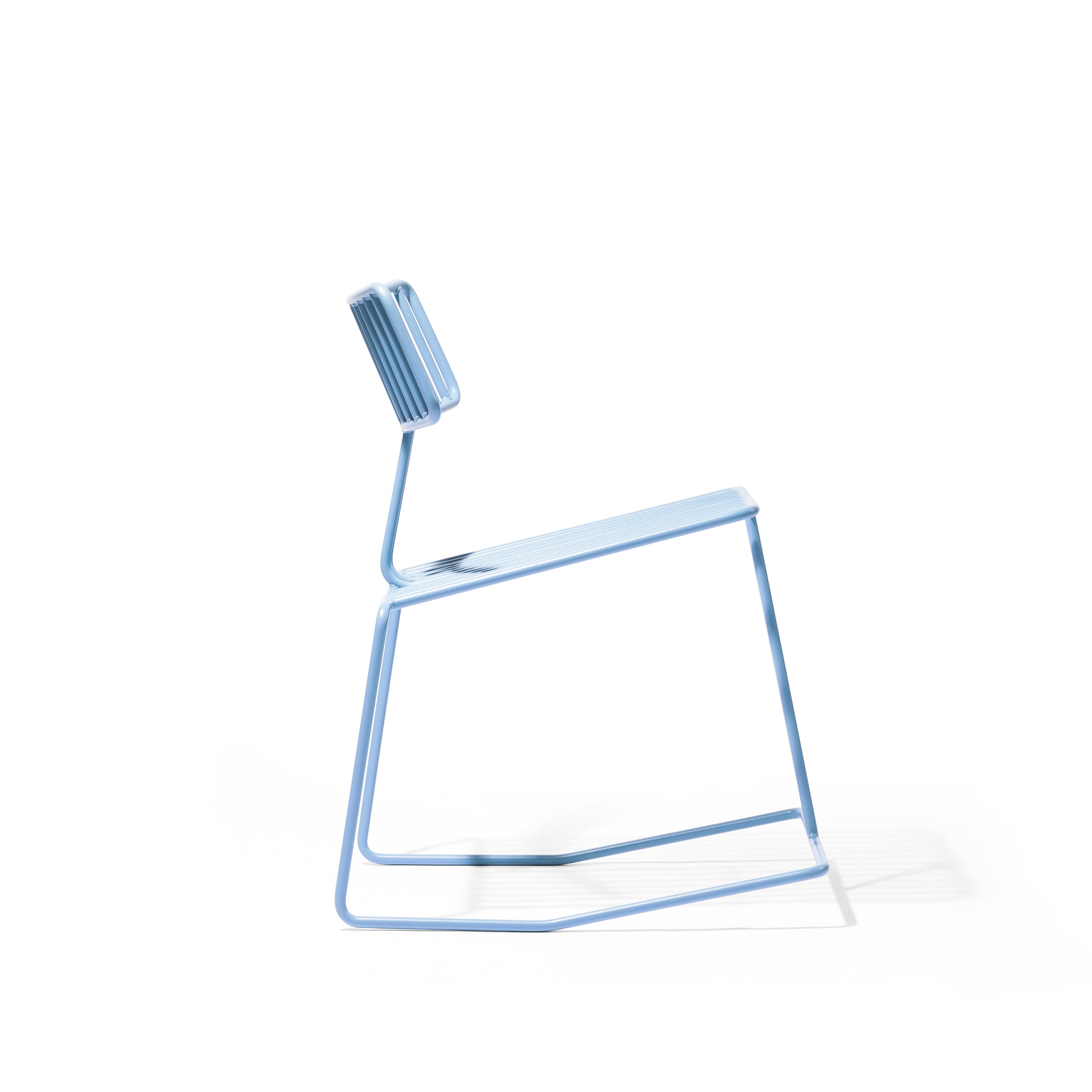 The Hope Chair by Egoé is a minimalist blue metal design with a thin geometric frame, featuring a rectangular backrest and flat seat supported by angled legs that cast shadows on the white background.