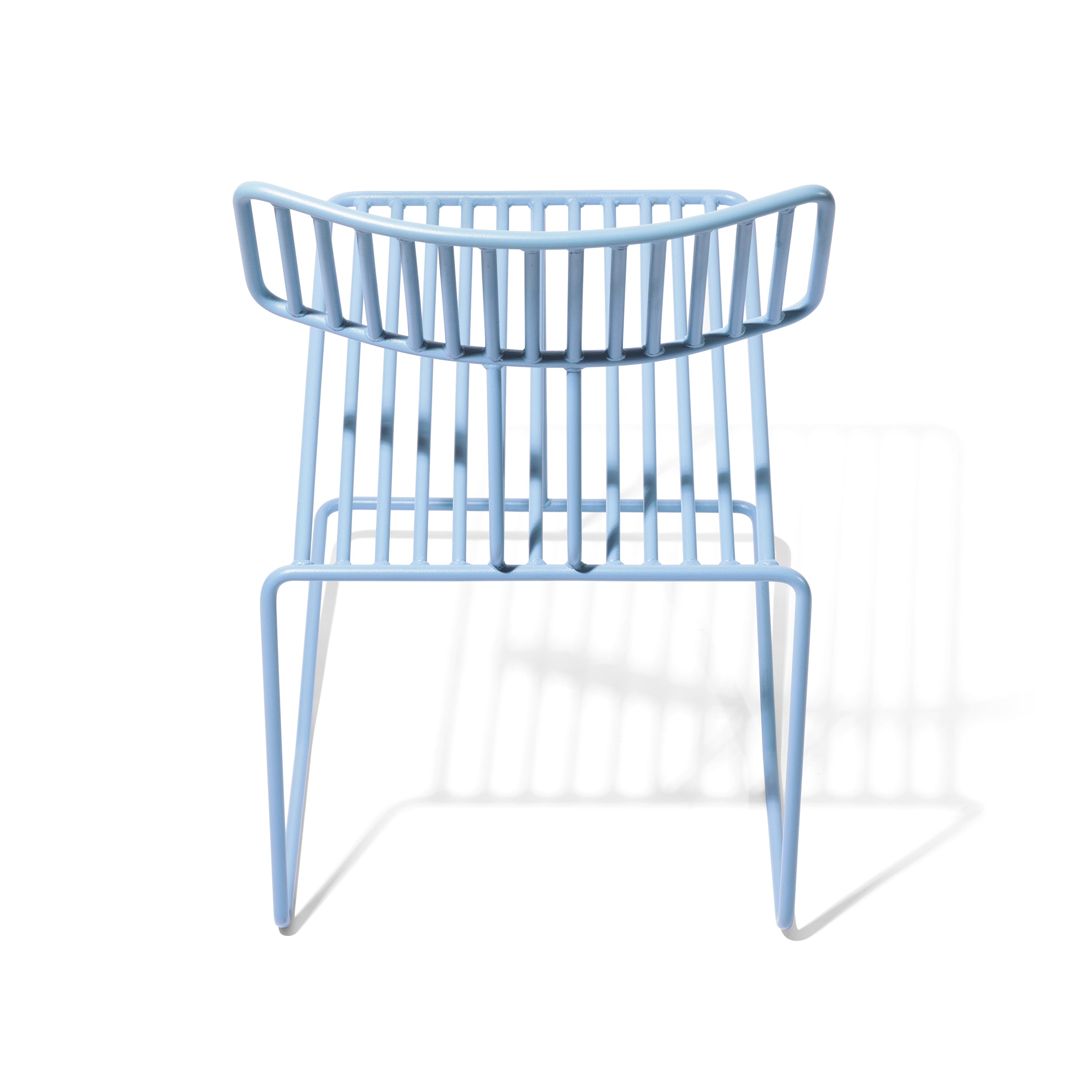 Egoés Hope Chair features a modern design with a light blue metal frame, curved backrest, and vertical slats. It casts a soft shadow on a white background, highlighting its contemporary allure.