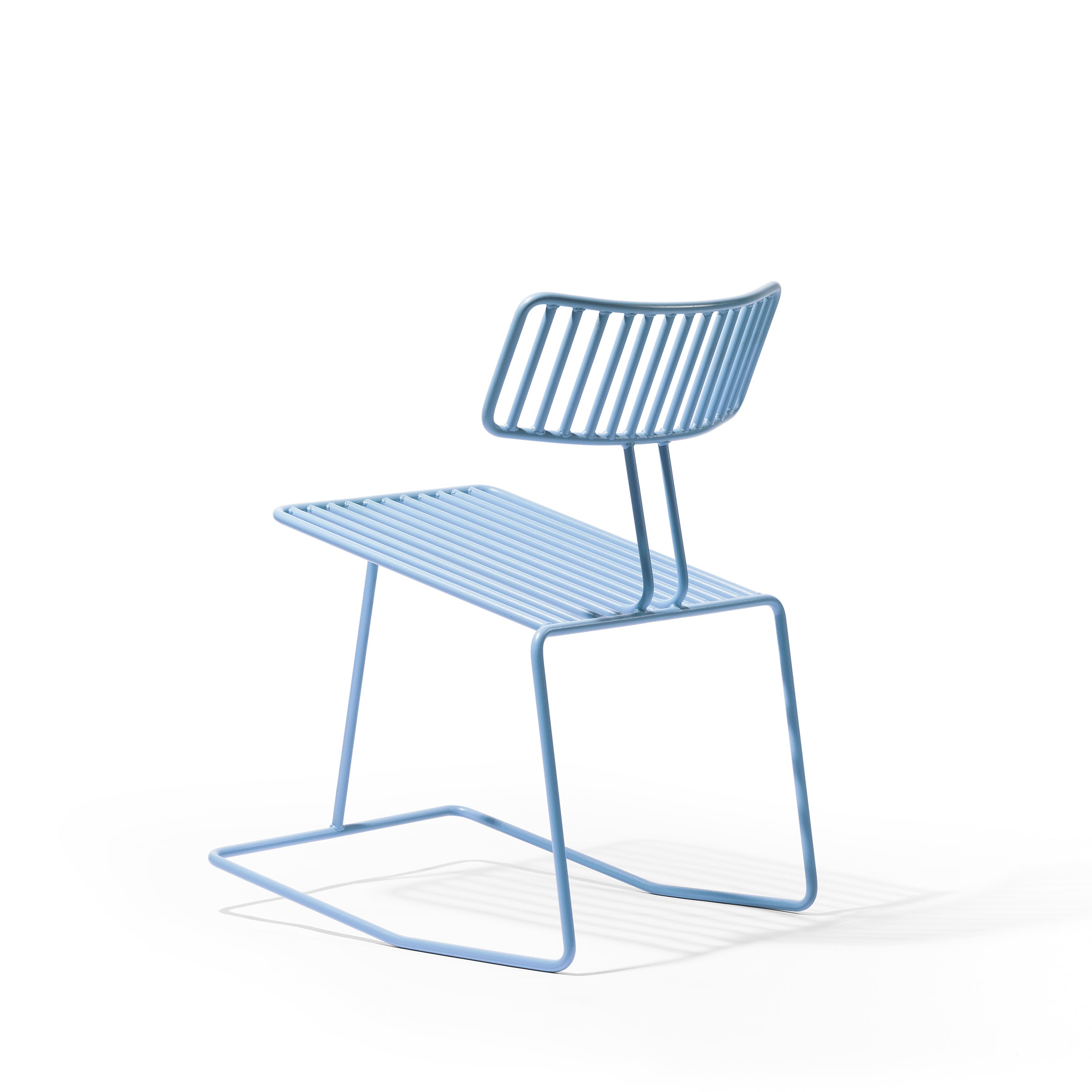 The Hope Chair from Egoé is an elegant blue metal chair featuring a minimalist slatted design on the seat and backrest, complemented by a sleek sled base set against a clean white background.