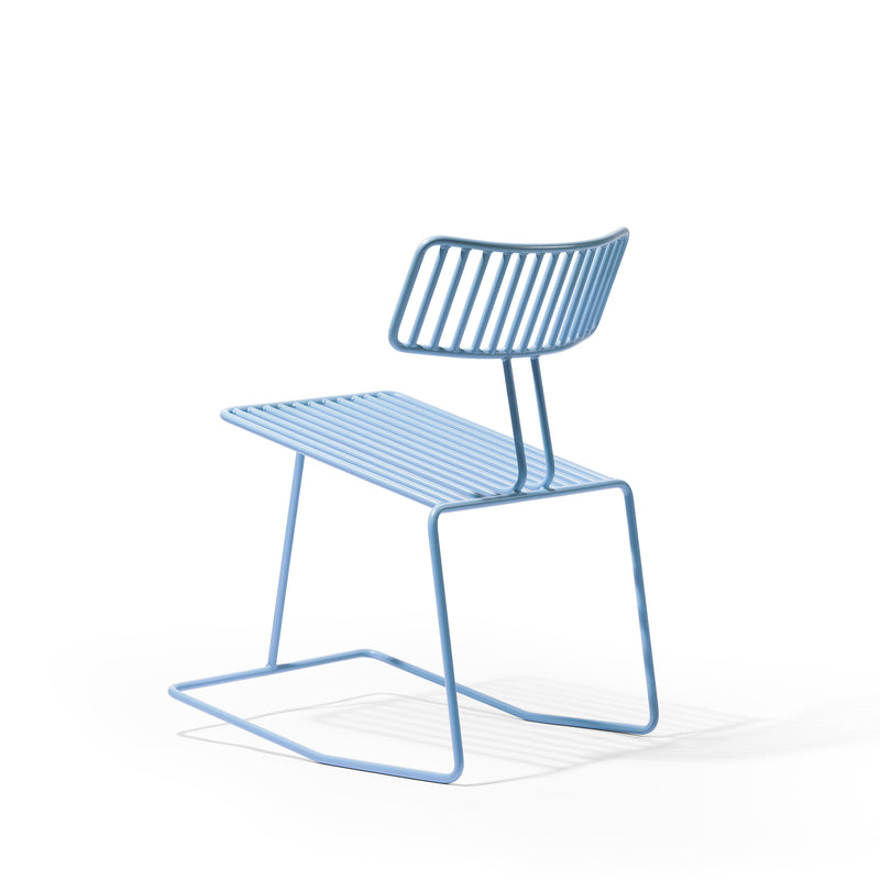 The Hope Chair from Egoé is an elegant blue metal chair featuring a minimalist slatted design on the seat and backrest, complemented by a sleek sled base set against a clean white background.