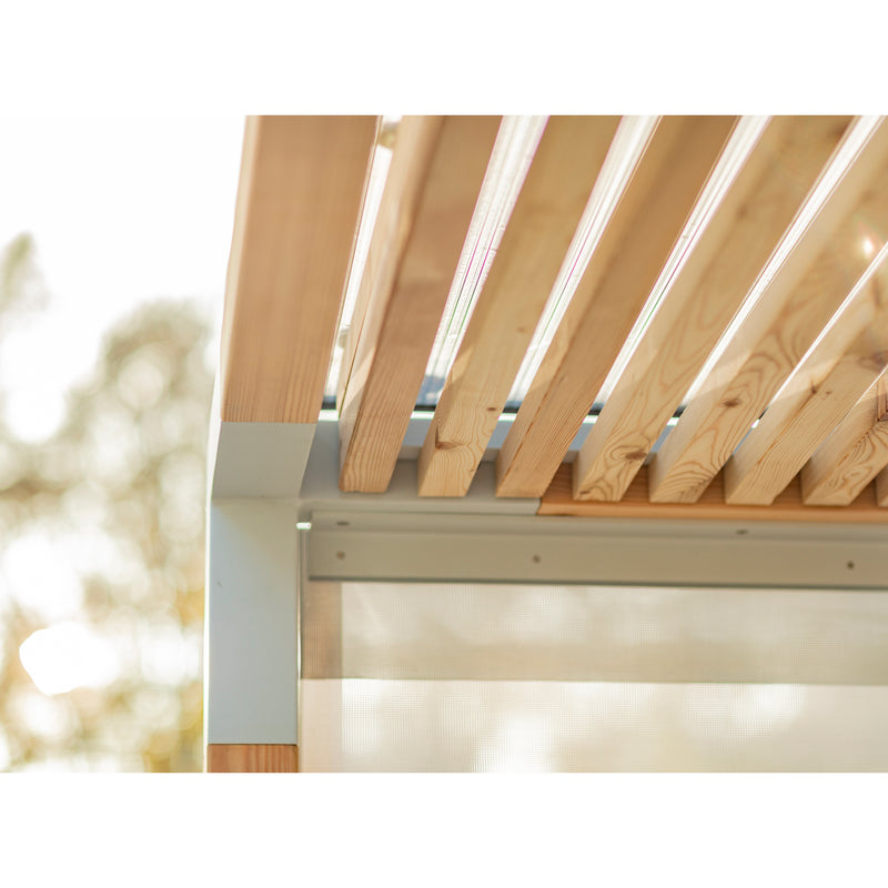 Close-up of the Leva Public pergola by Egoe, featuring horizontal wooden slats and a light-colored metal frame—perfect for an outdoor office. Soft sunlight filters through, creating gentle patterns while the blurred natural background adds warmth and invites tranquility.