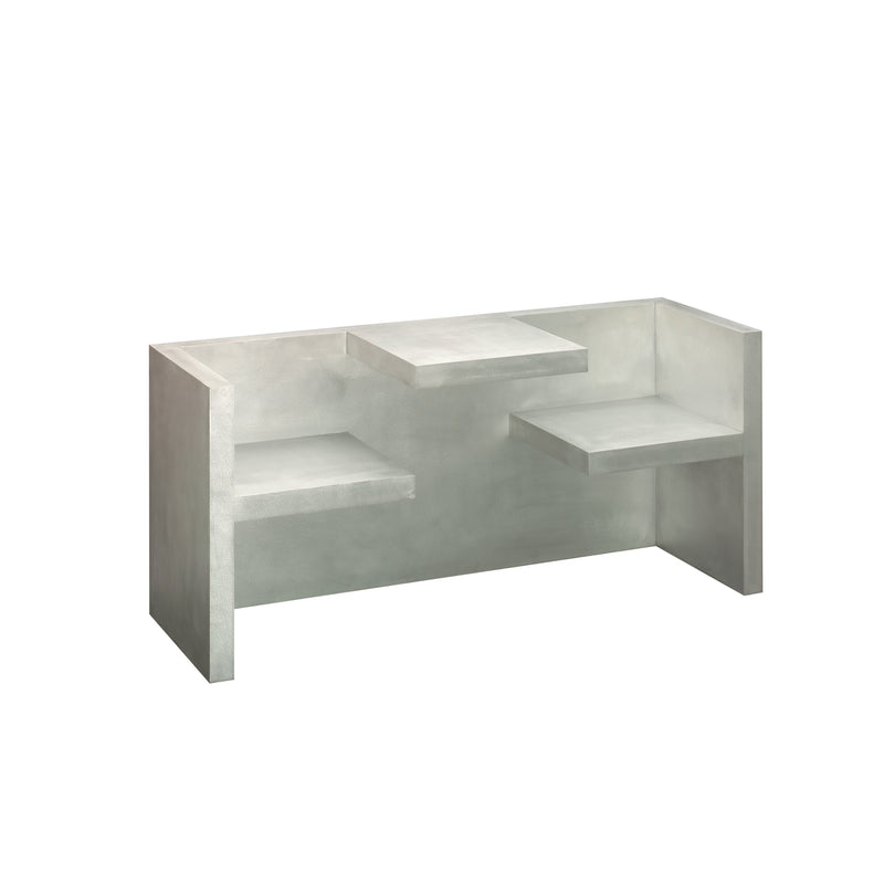 The HP01 TAFEL by E15 is a minimalist concrete bench with three angular, geometric levels. It features protruding and recessed platforms for a unique sitting experience. Its light gray color enhances its industrial and modern look.