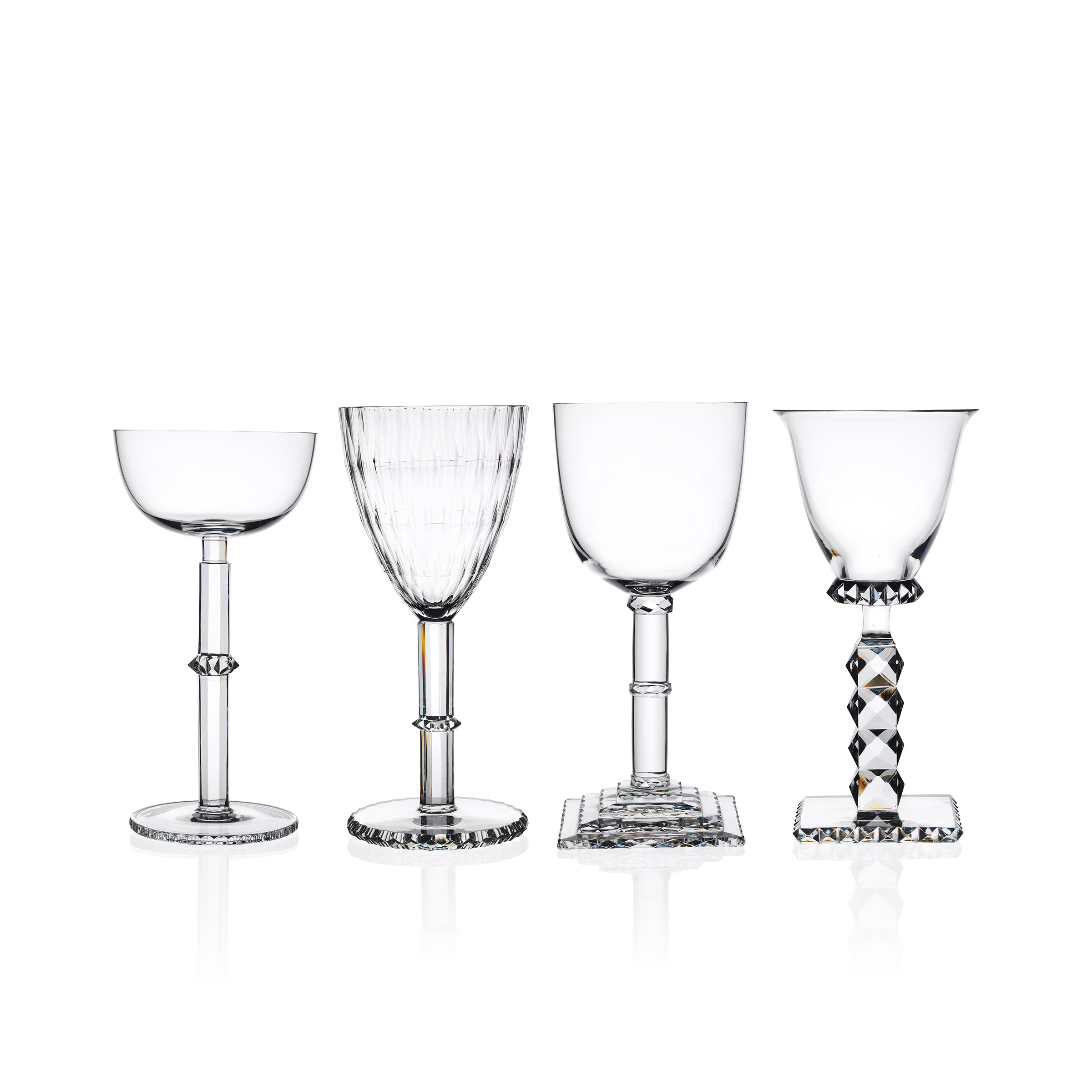 Four elegant Hoffmann Goblets by Lobmeyr, crafted from mouth-blown lead-free crystal, display unique Josef Hoffmann-inspired designs on their stems and bases. Set against a white background, each glass showcases varying shapes like round, fluted, and square bases.