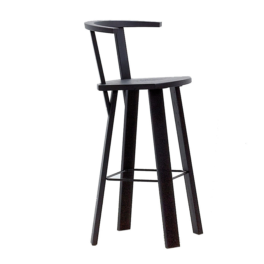 The Alpin Barstool with Armrest by Hussl is a modern black stool inspired by EOOS design, boasting a minimalistic style with a curved backrest, angled legs, and footrest.