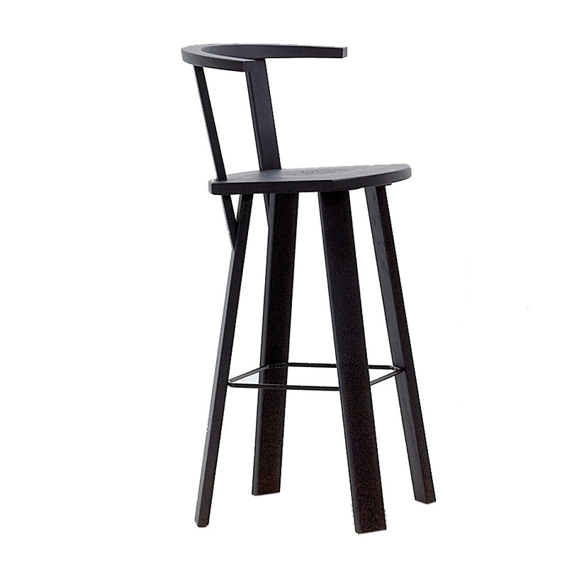 The Alpin Barstool with Armrest by Hussl is a modern black stool inspired by EOOS design, boasting a minimalistic style with a curved backrest, angled legs, and footrest.