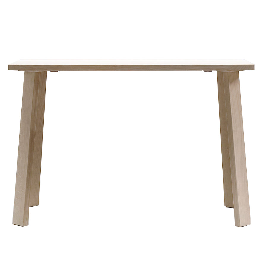 The Alpin Bar Table by Hussl features a minimalist EOOS design, showcasing a light wood rectangular top with four angled legs. Its Alpine furniture style reflects modern elegance and is presented against a white background.