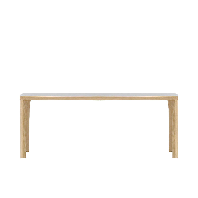 The ST6 Bench by Hussl is a stylishly elegant, minimalist wooden piece with a light finish and simple design, reminiscent of Austrian coffee house furnishings. It features four straight legs and a flat rectangular seat, photographed against a plain white background.