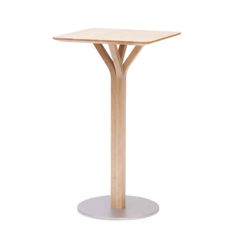 Introducing the Bloom Bar Table Square by TON: a modern, minimalist design featuring a tall, light wood pedestal with a square top. Its unique Y-shaped support rests elegantly on a round metal base, showcasing the sophistication of solid wood tables in various heights.
