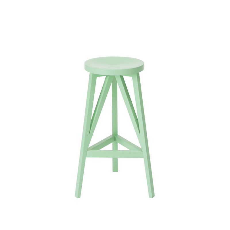 The JL4 Faber Barstool by Loehr is a mint green, round stool with four legs and a triangular support structure. Its smooth design reflects northern European architecture, and it stands out against a plain white background.