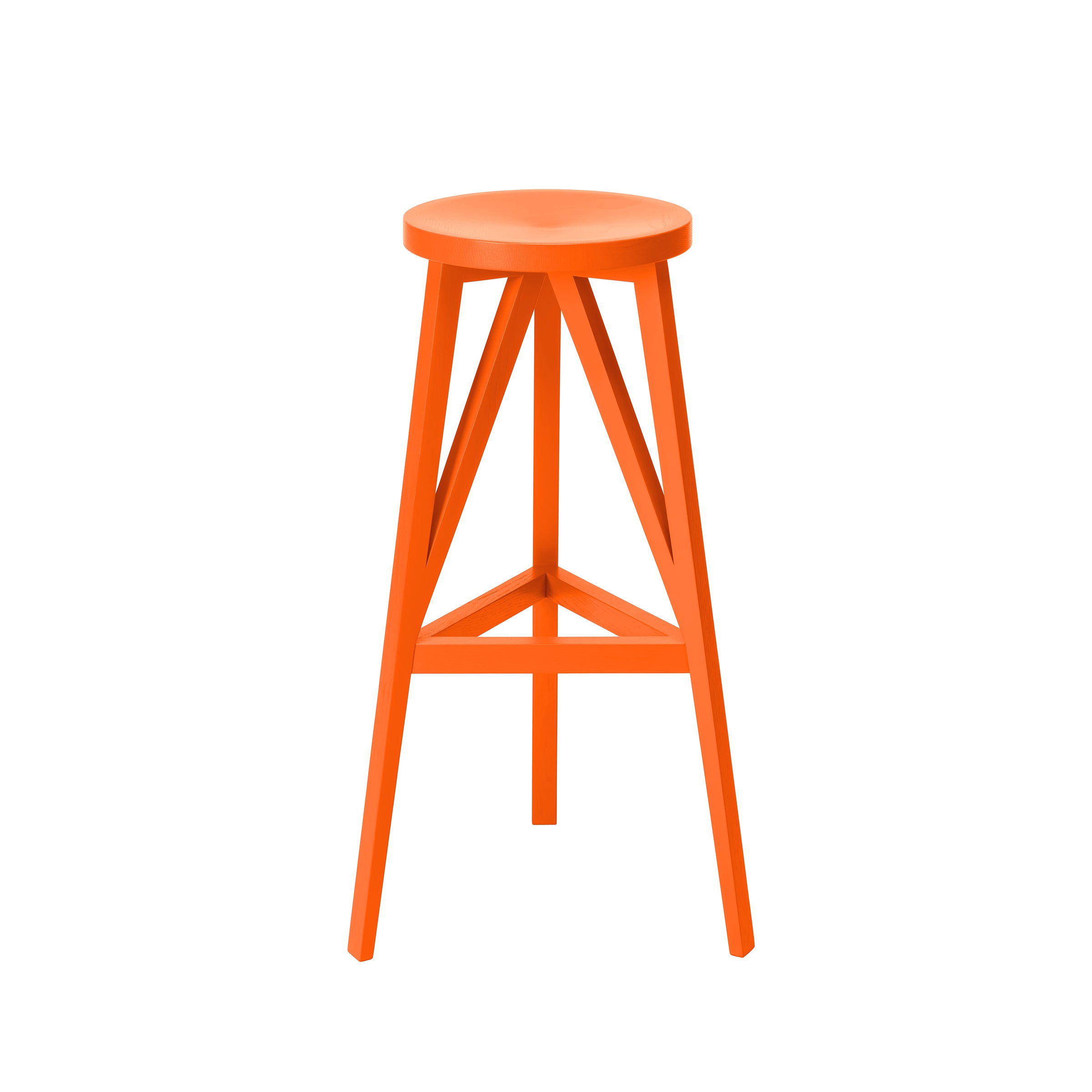 The JL4 Faber Barstool by Loehr is an orange stool with a distinctive silhouette, featuring a circular seat and three legs connected by triangular supports. Crafted from solid oak, its design evokes northern European architecture against a white backdrop.