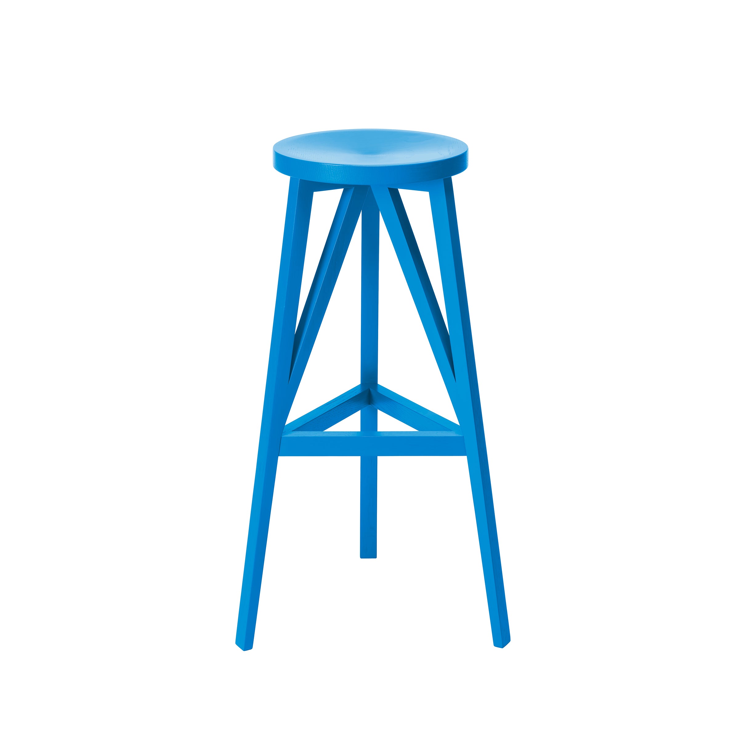 The JL4 Faber Barstool by Loehr features a bright blue, wooden design with a round seat and four legs. Its silhouette is inspired by northern European architecture, enhanced by triangular supports. The stool stands out against a plain white background.